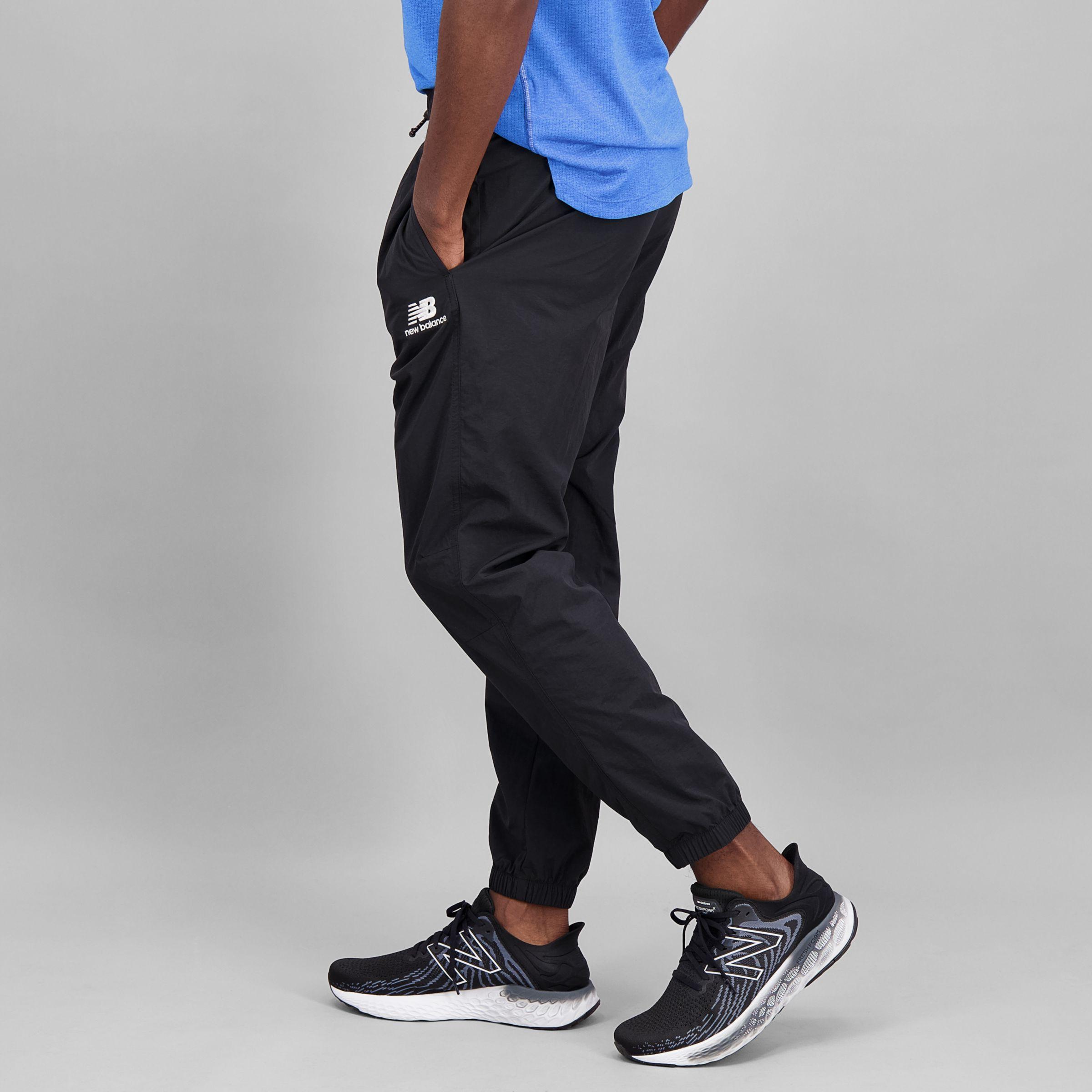 New Balance Nb Athletics Higher Learning Wind Trousers in Black for Men |  Lyst