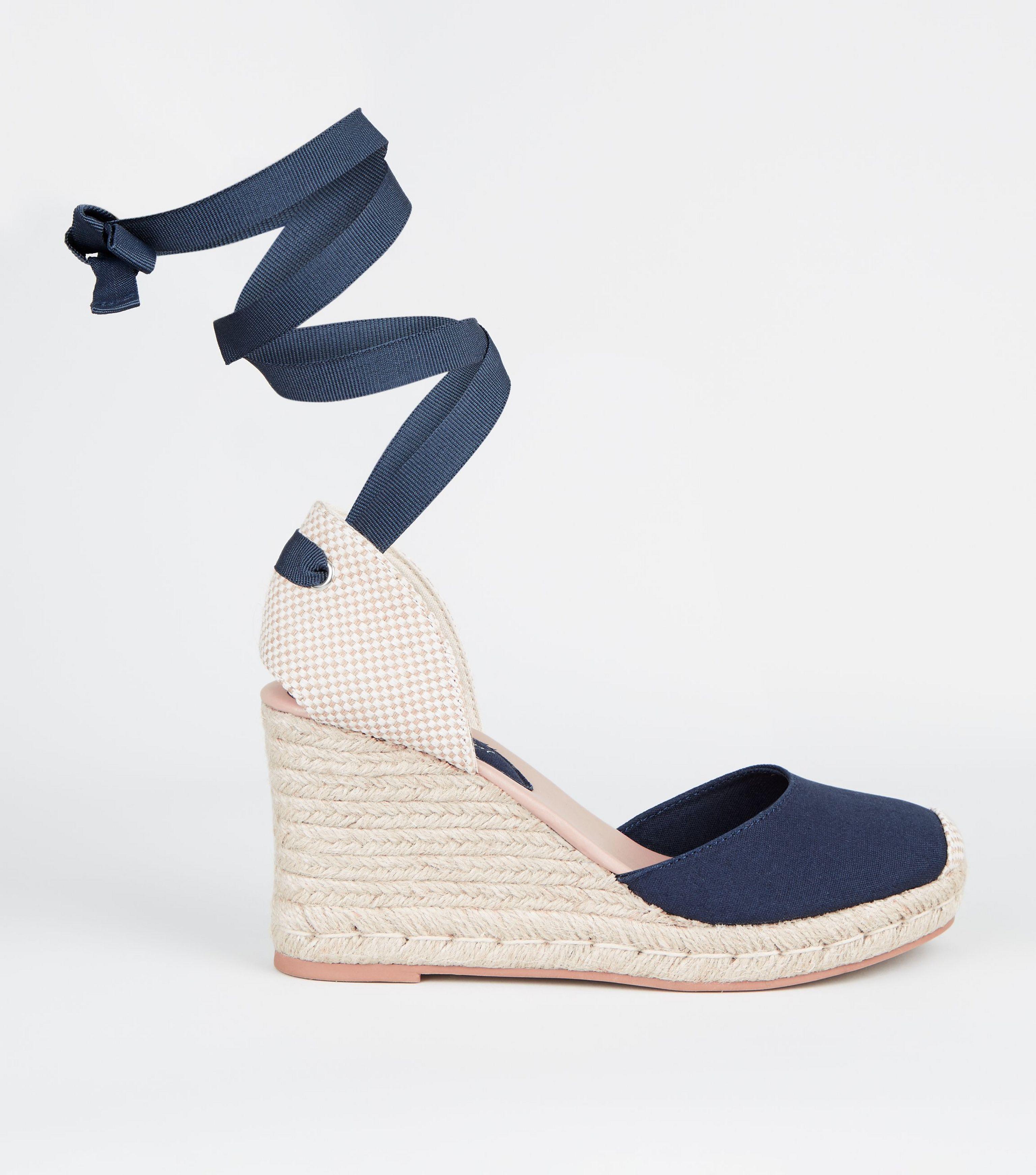 white wedges with ribbon tie