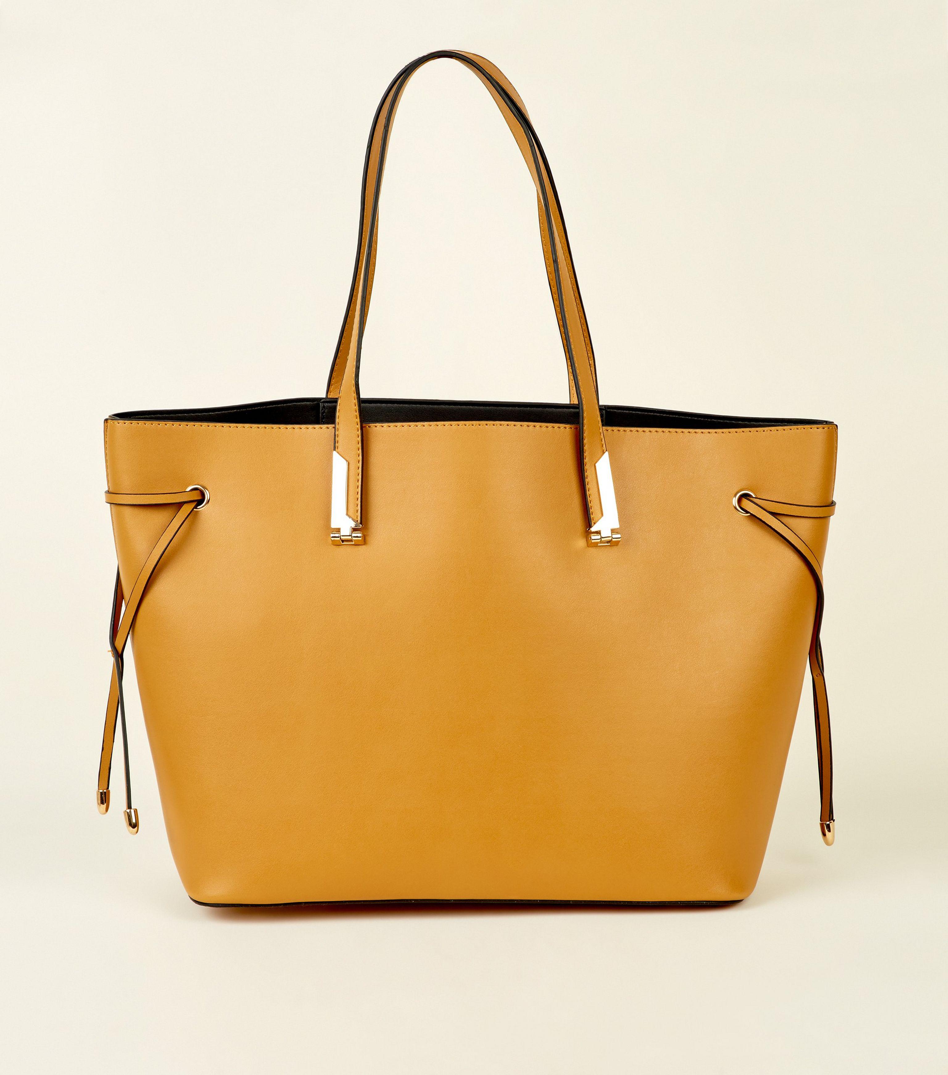 new look mustard clutch bag