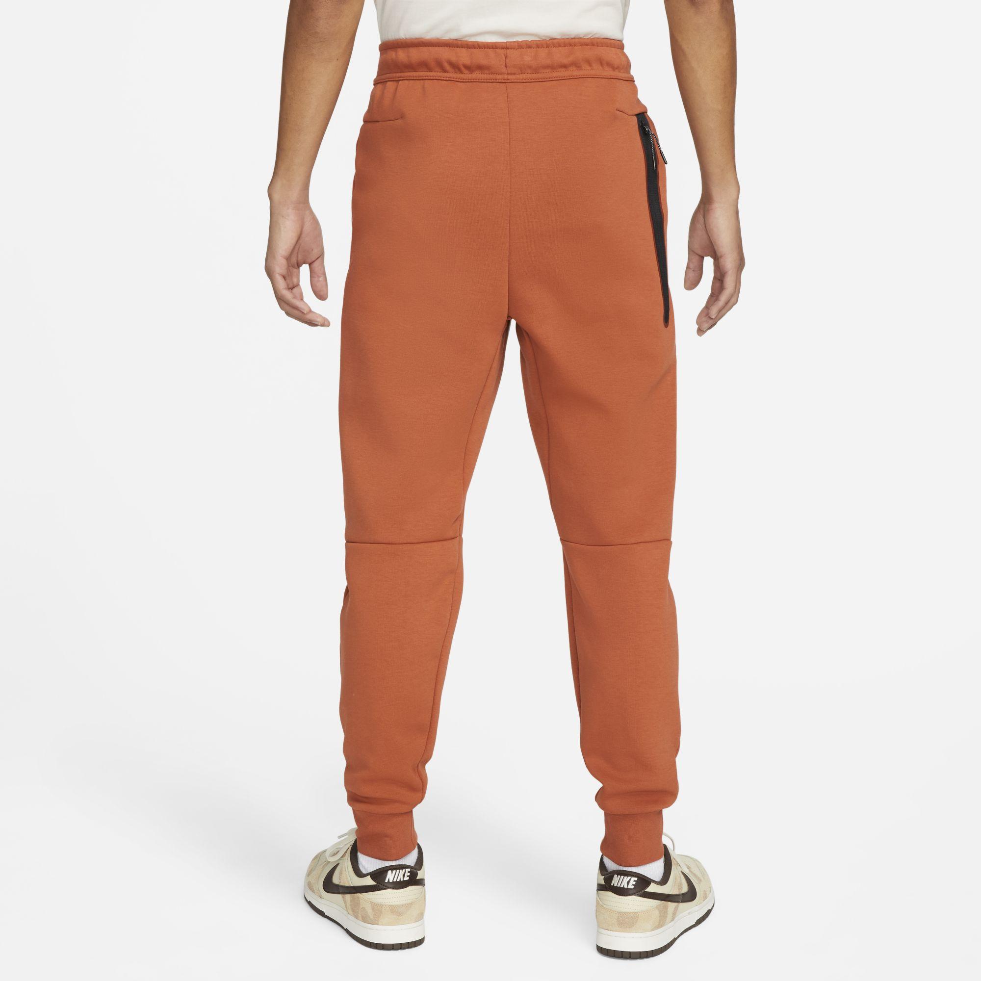 orange nike tech fleece pants