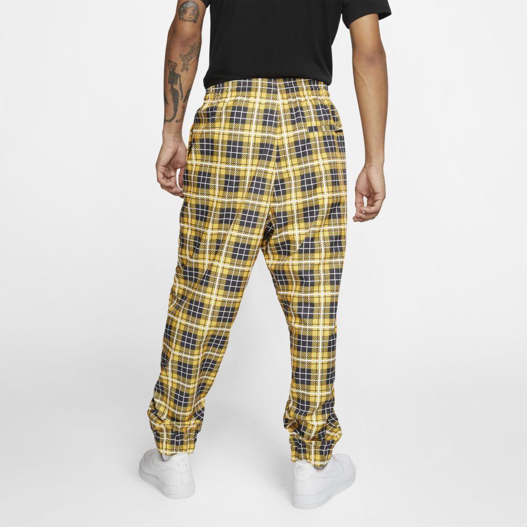 yellow nike tracksuit bottoms