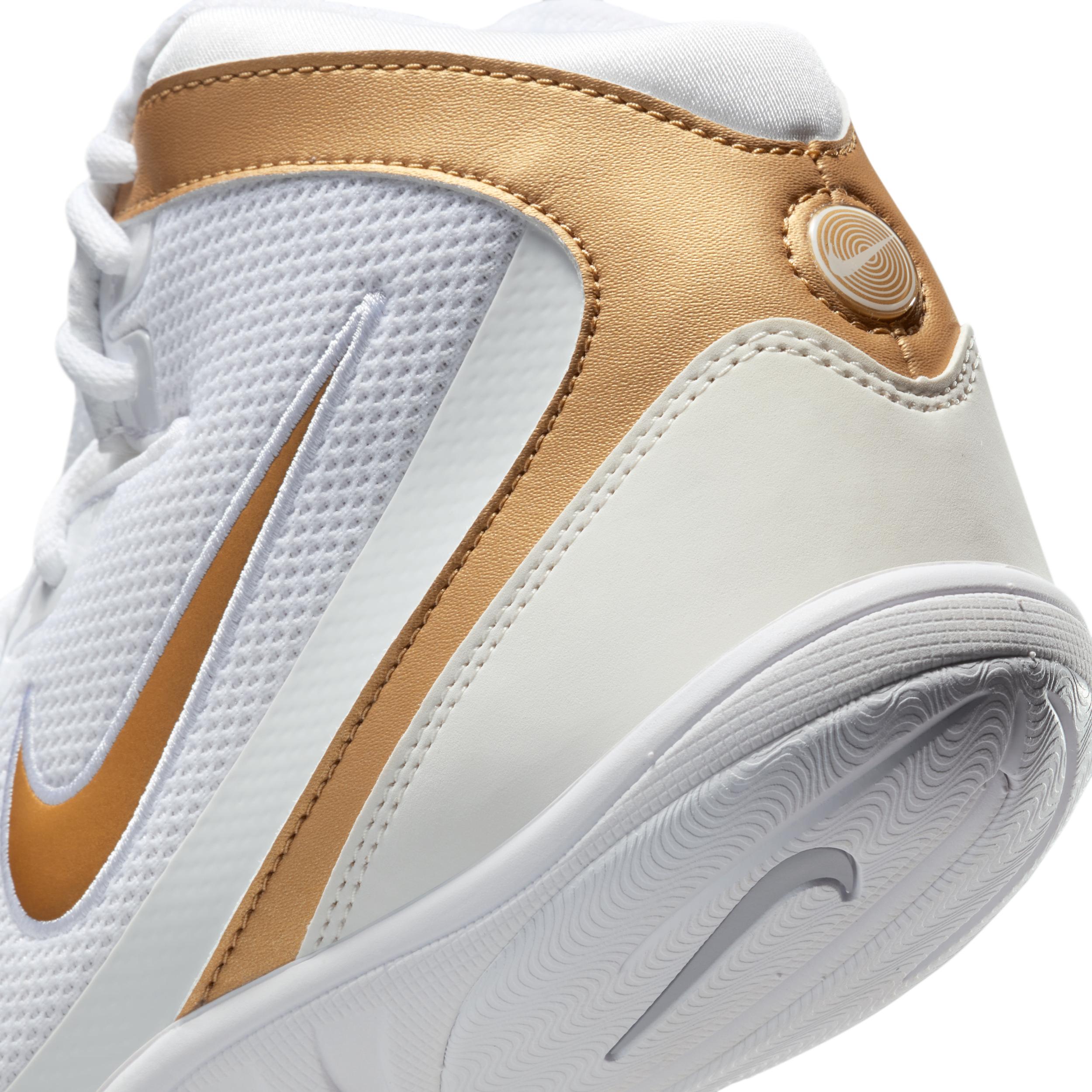 white and gold nike freeks
