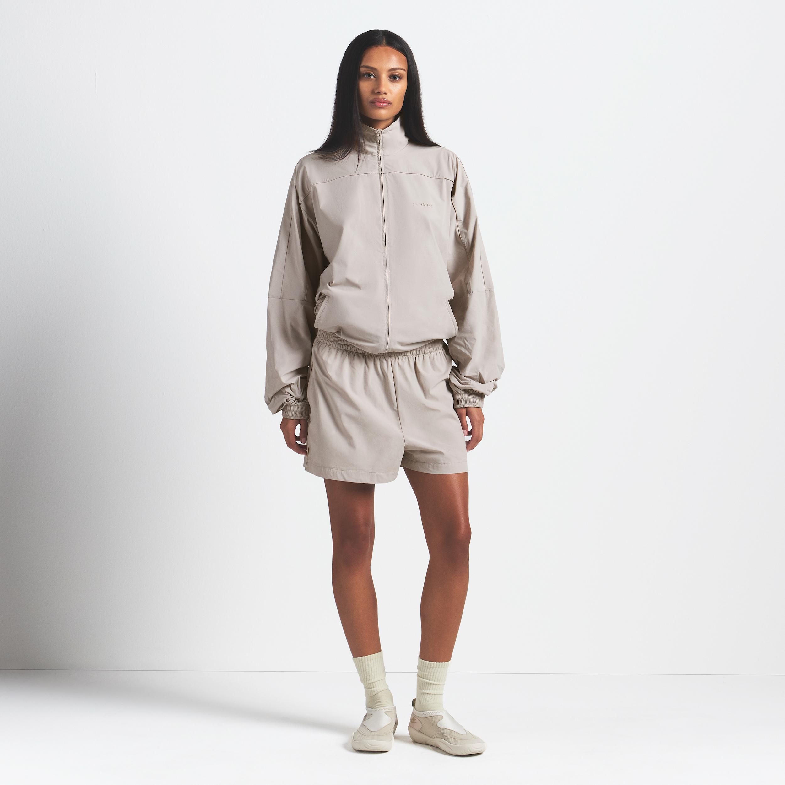 Nike Skims Woven Nylon Oversized Track Jacket in Natural | Lyst