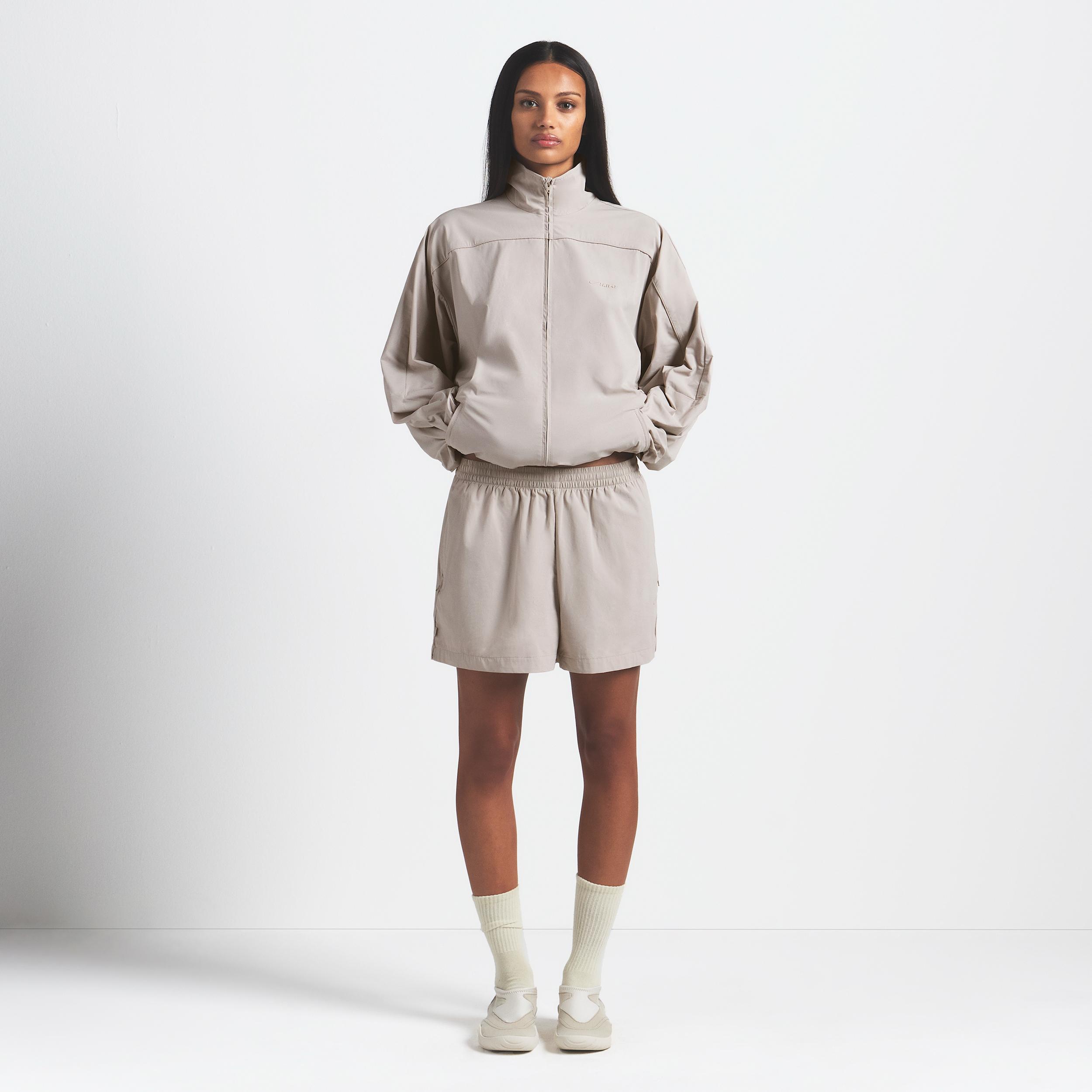 Nike Skims Woven Nylon Oversized Track Jacket in Natural | Lyst