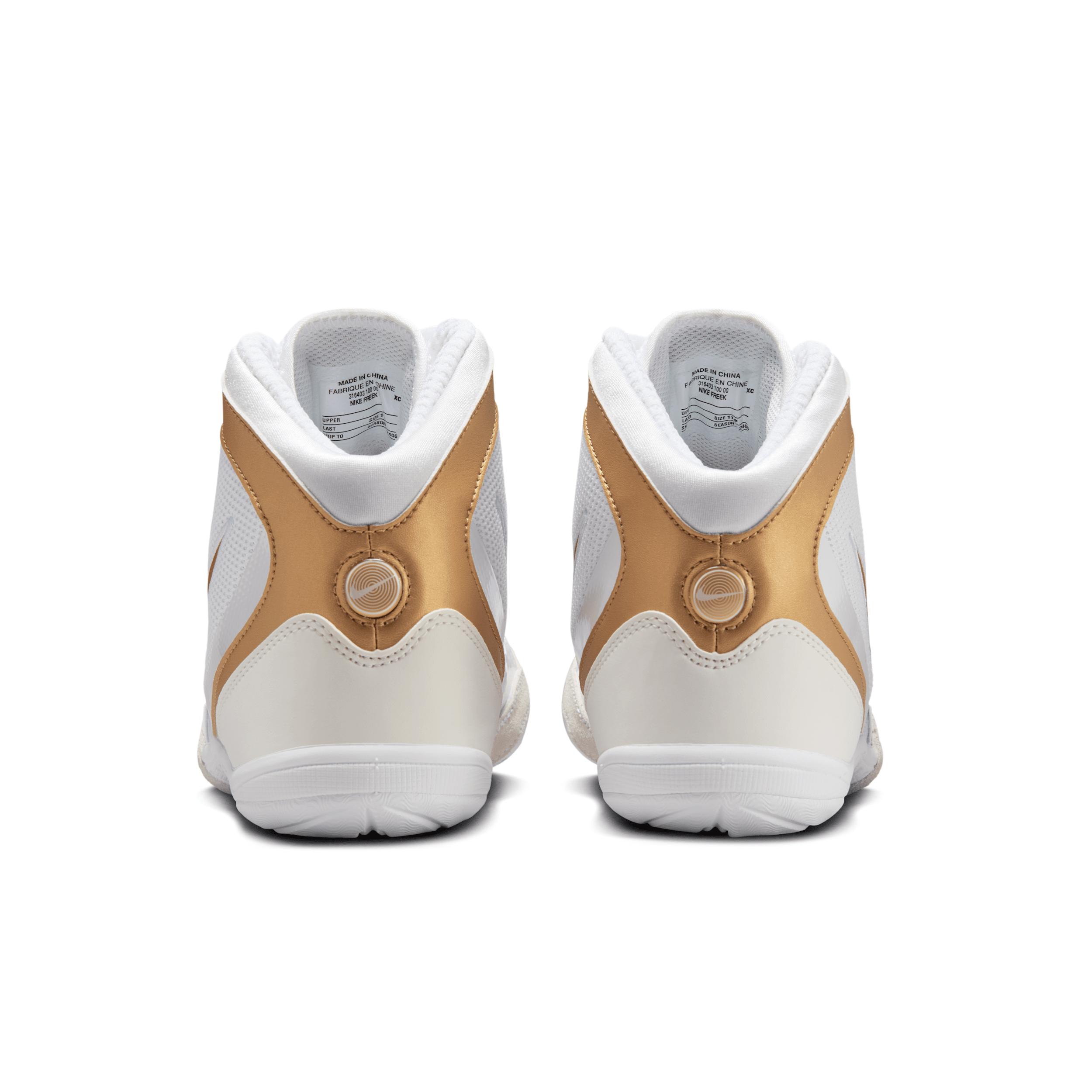 white and gold nike freeks