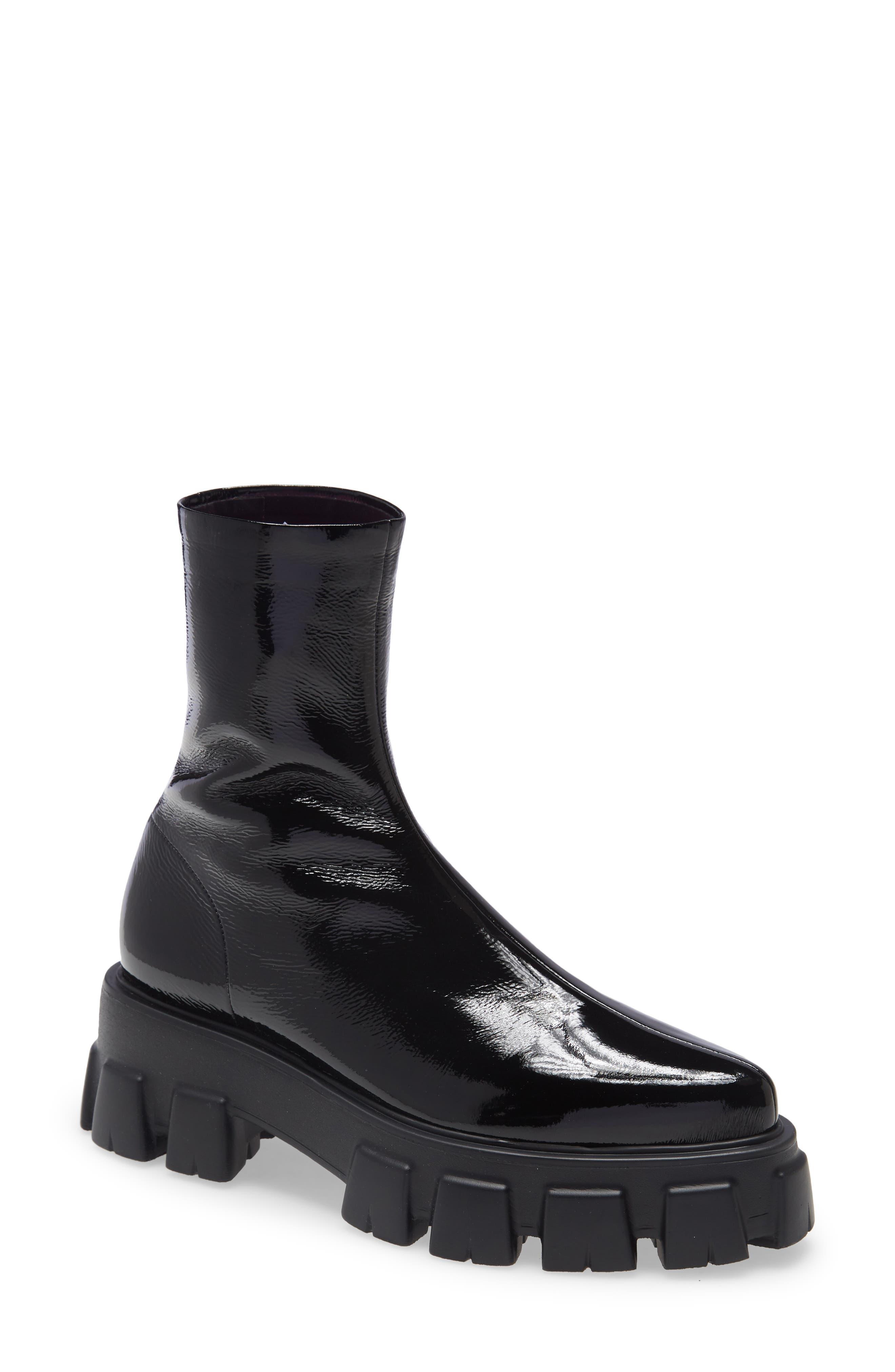 Edgy Elegance: Monolith Lug Sole Pointed Toe Boot Prada - Shoe Effect