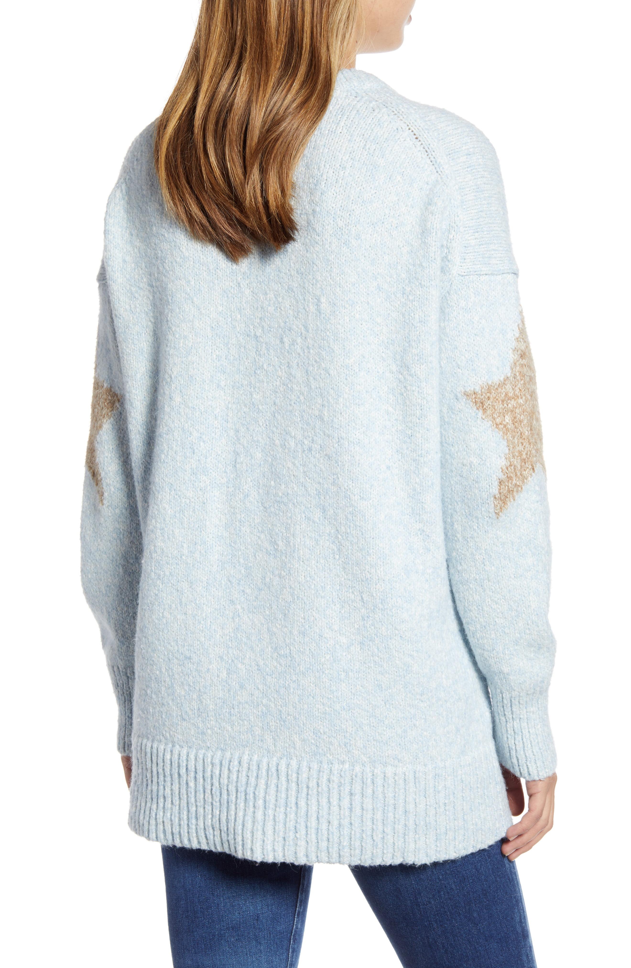 gray sweater with blue stars