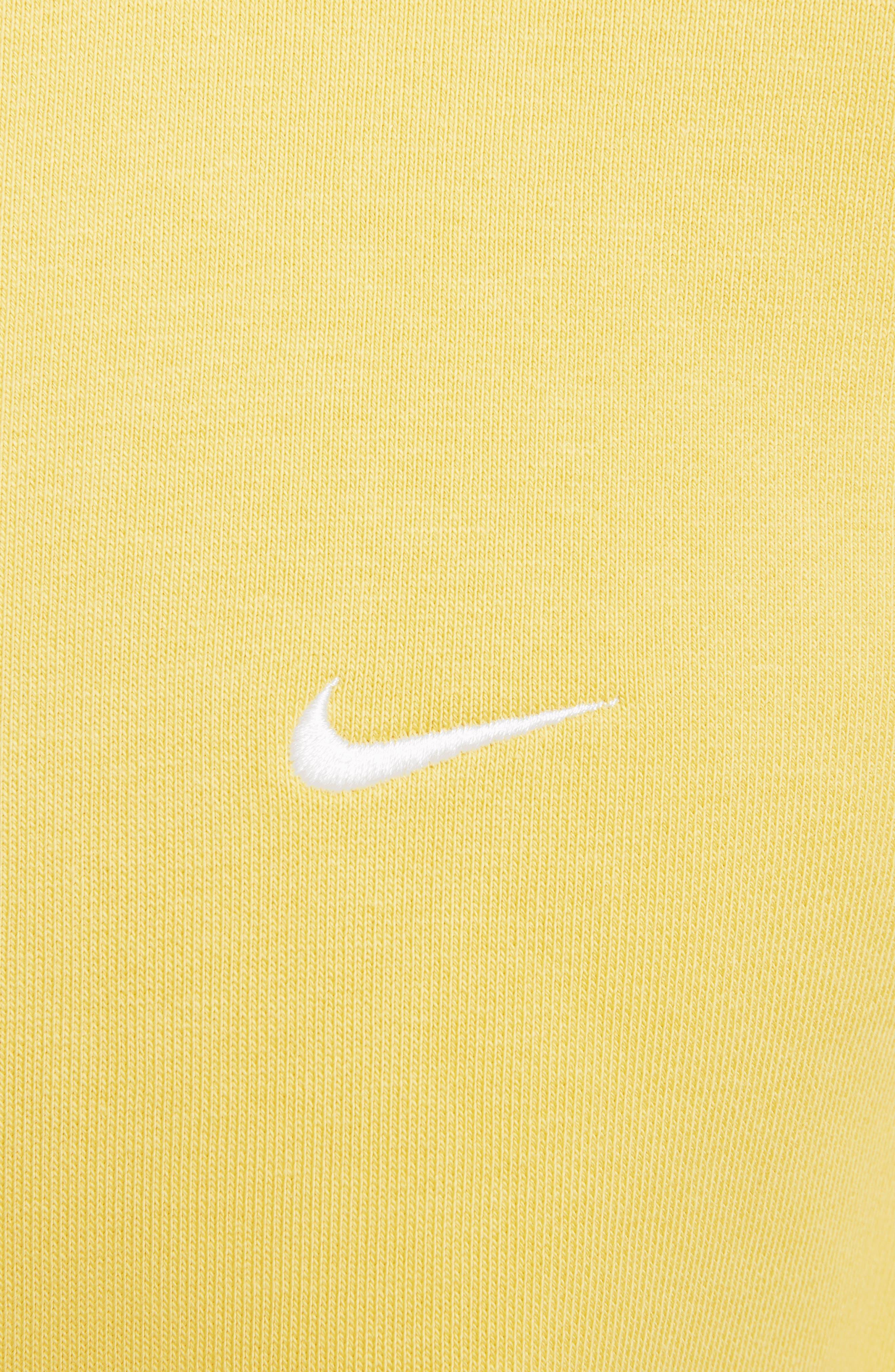 nikes with yellow swoosh