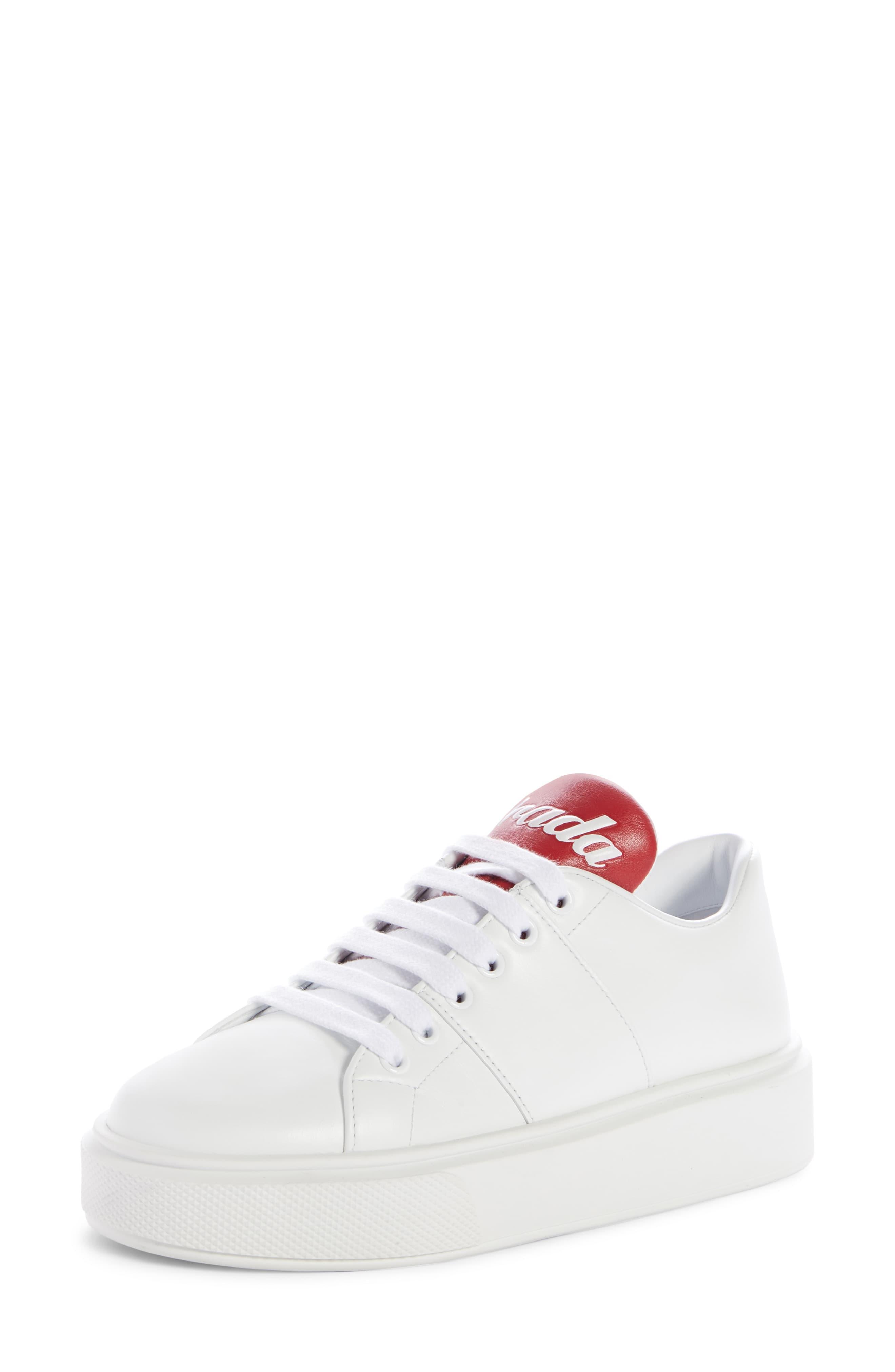 prada white sneakers with red stripe
