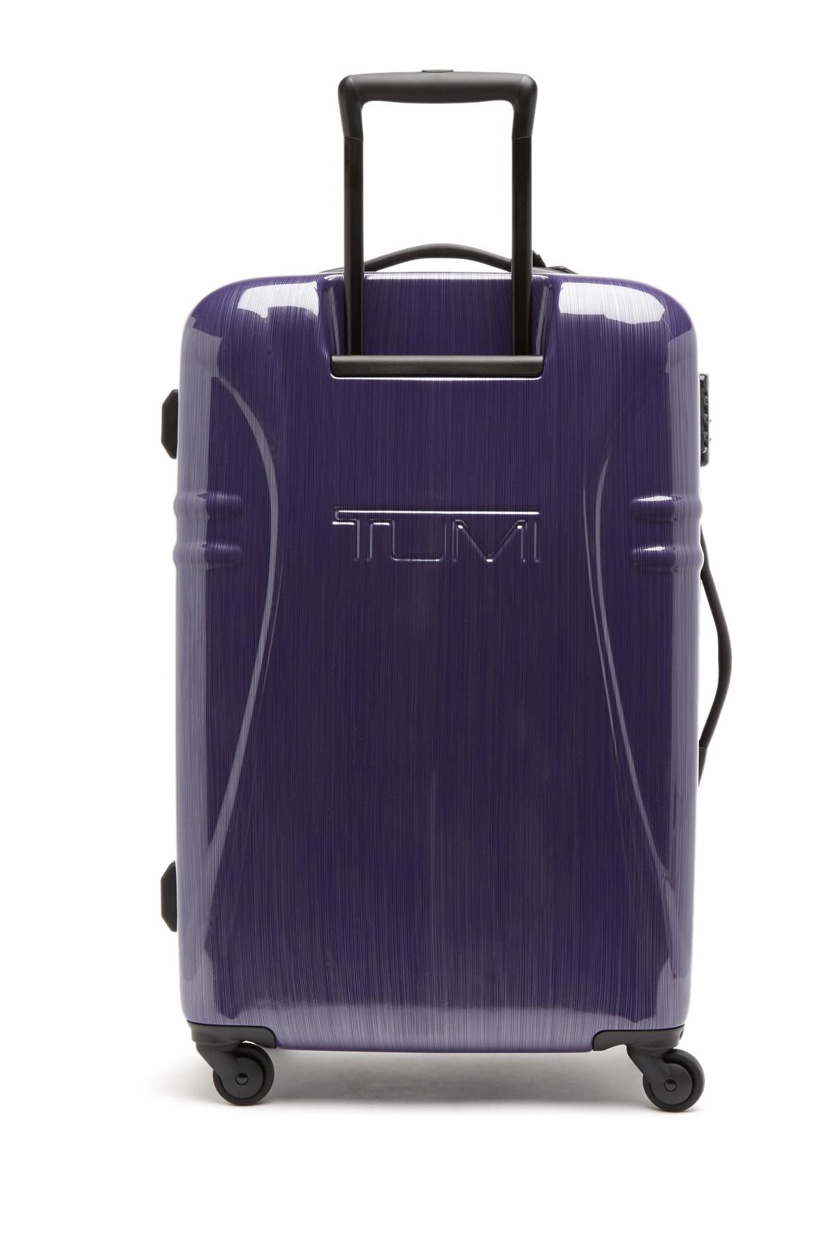 tumi purple luggage