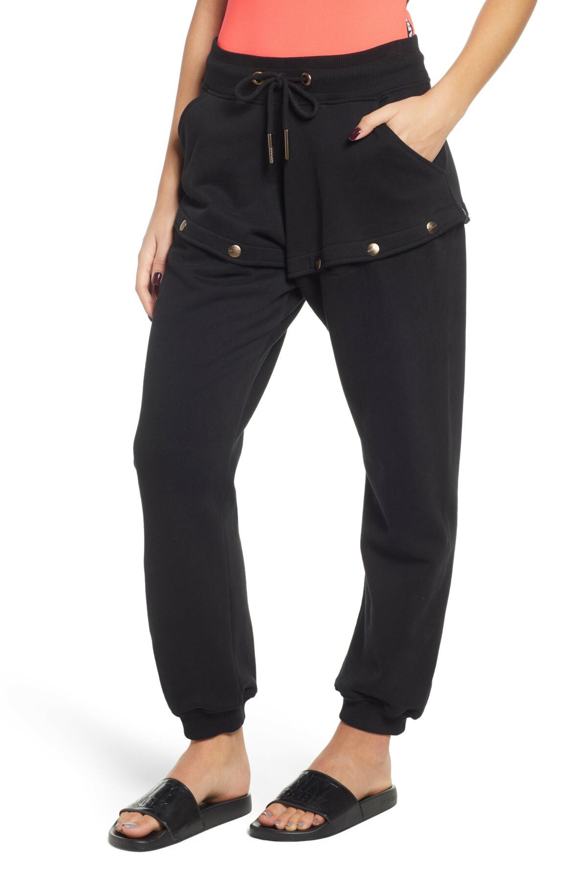Lyst - Ivy Park (r) Armour Popper Convertible Joggers in Black1200 x 1800