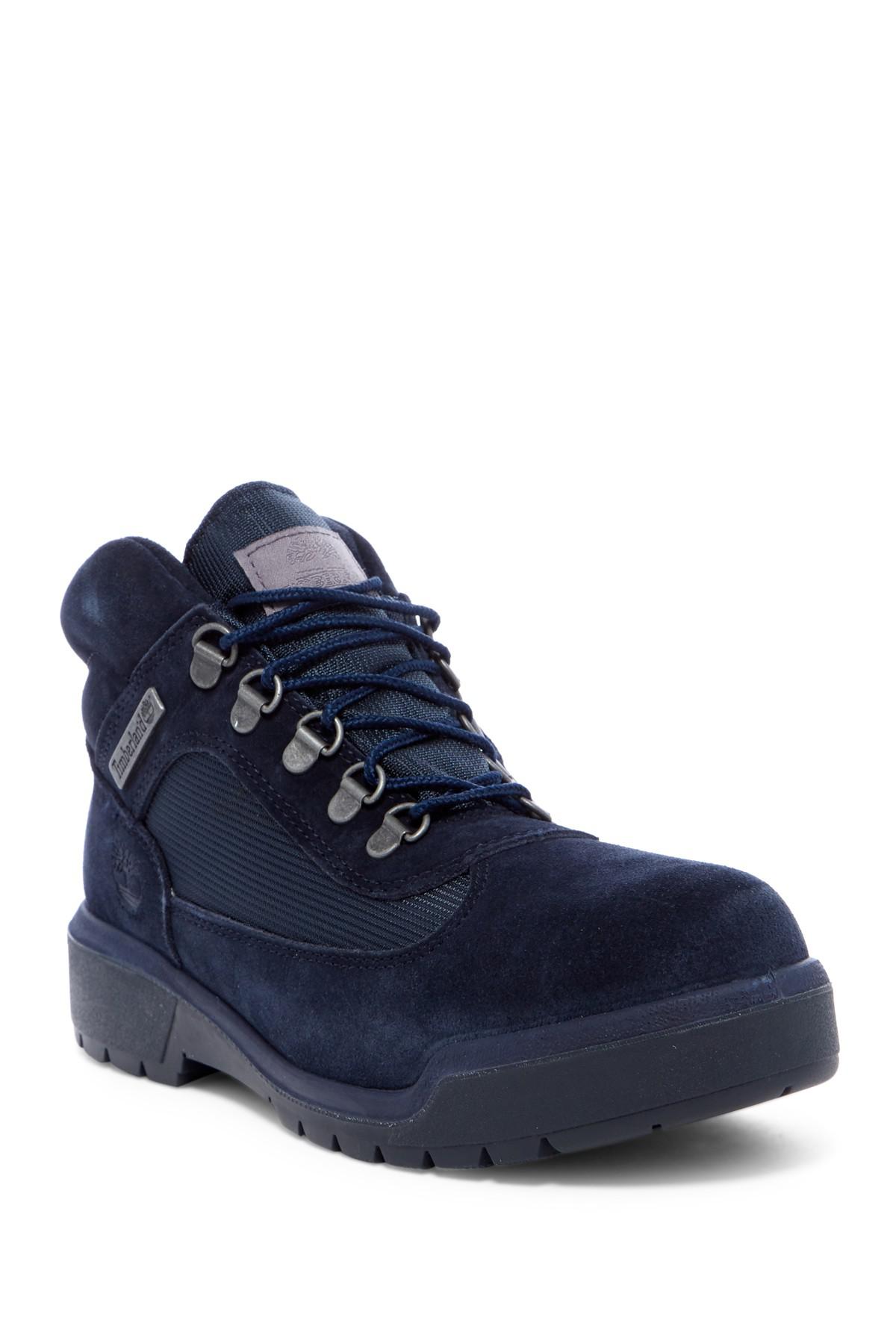 red and blue timberland field boots