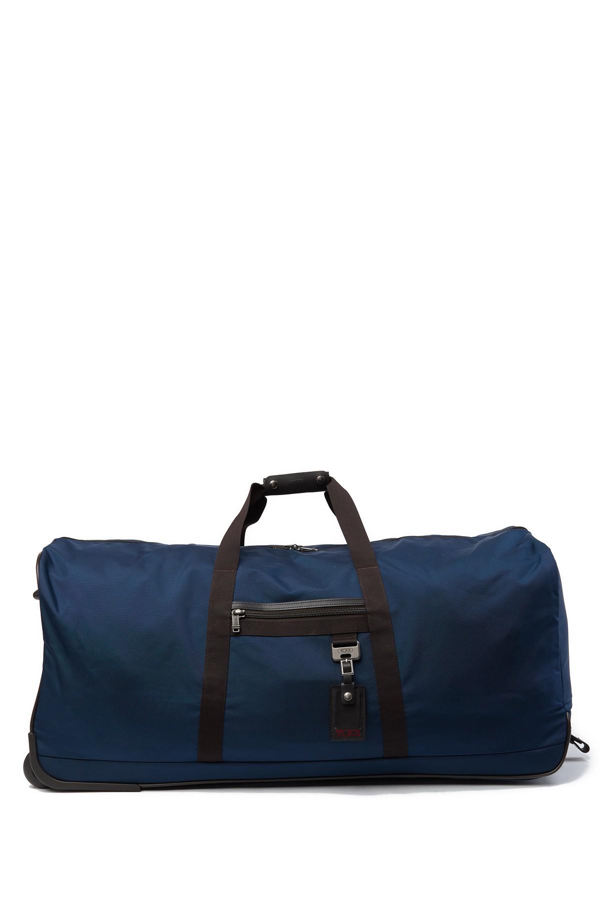 Tumi Bridgeway Collapsible Wheeled Duffel Bag in Blue | Lyst