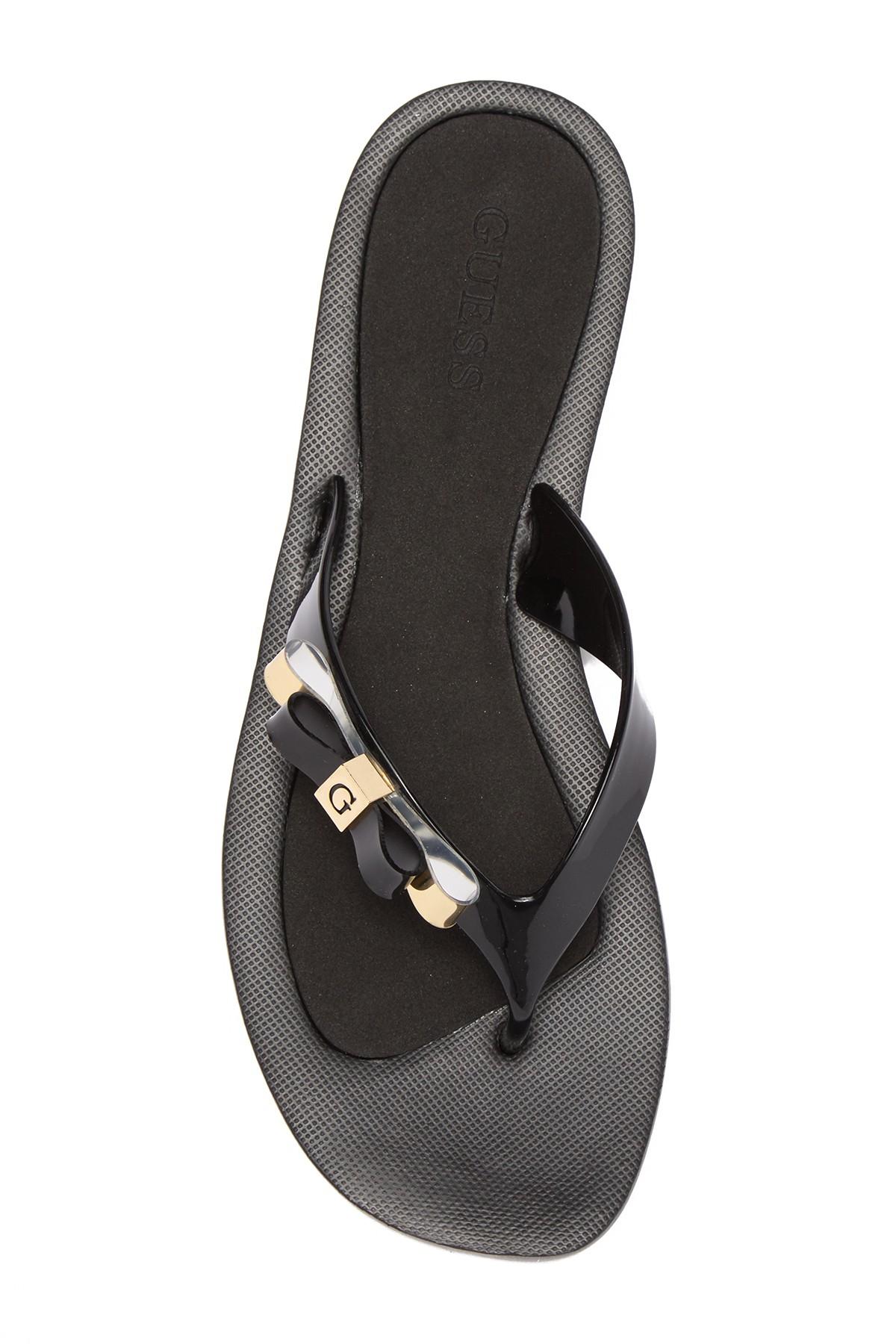 guess black flip flops with bow