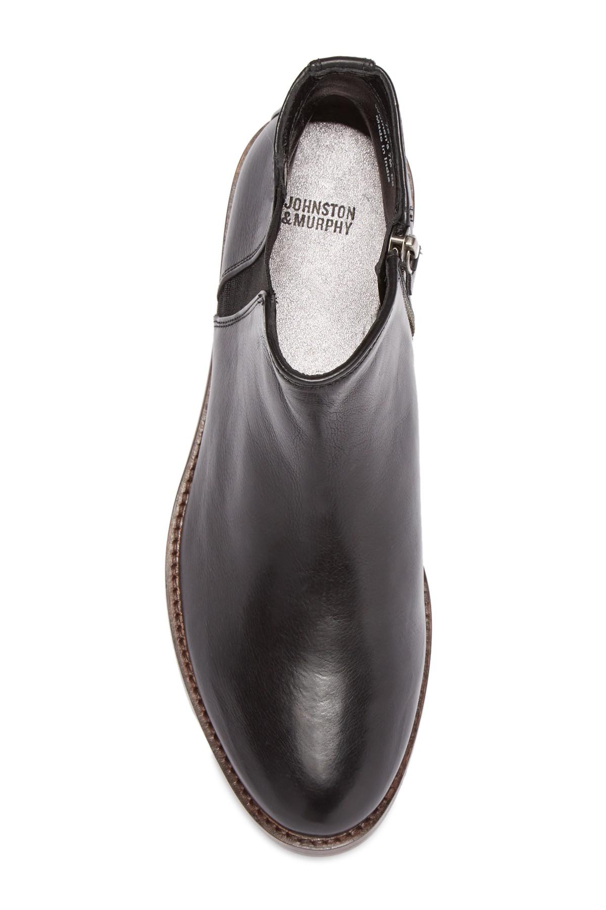 tall brown boots with red zipper