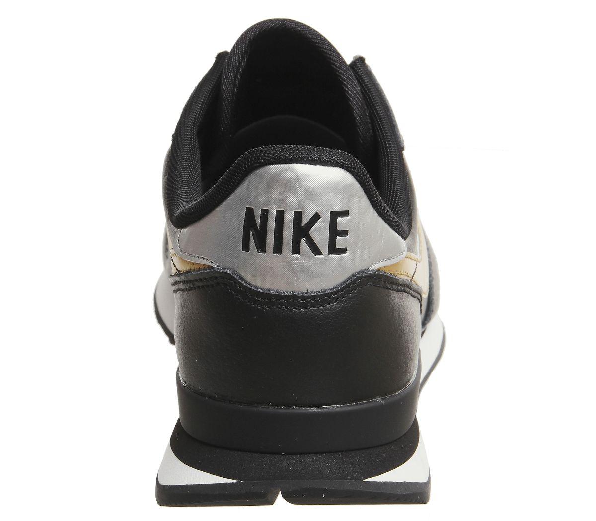 nike black and gold internationalist sneakers