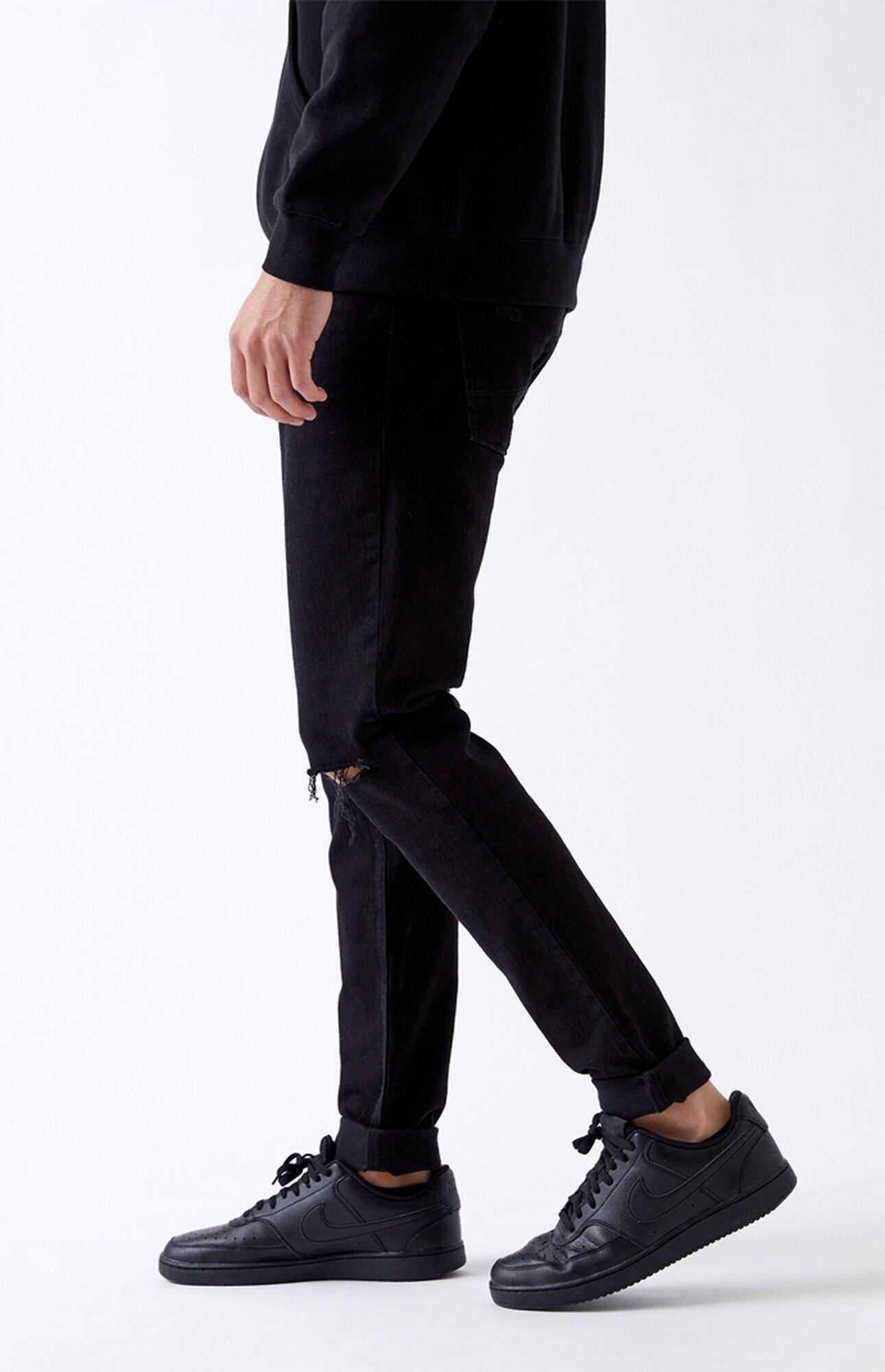 black stacked ripped jeans
