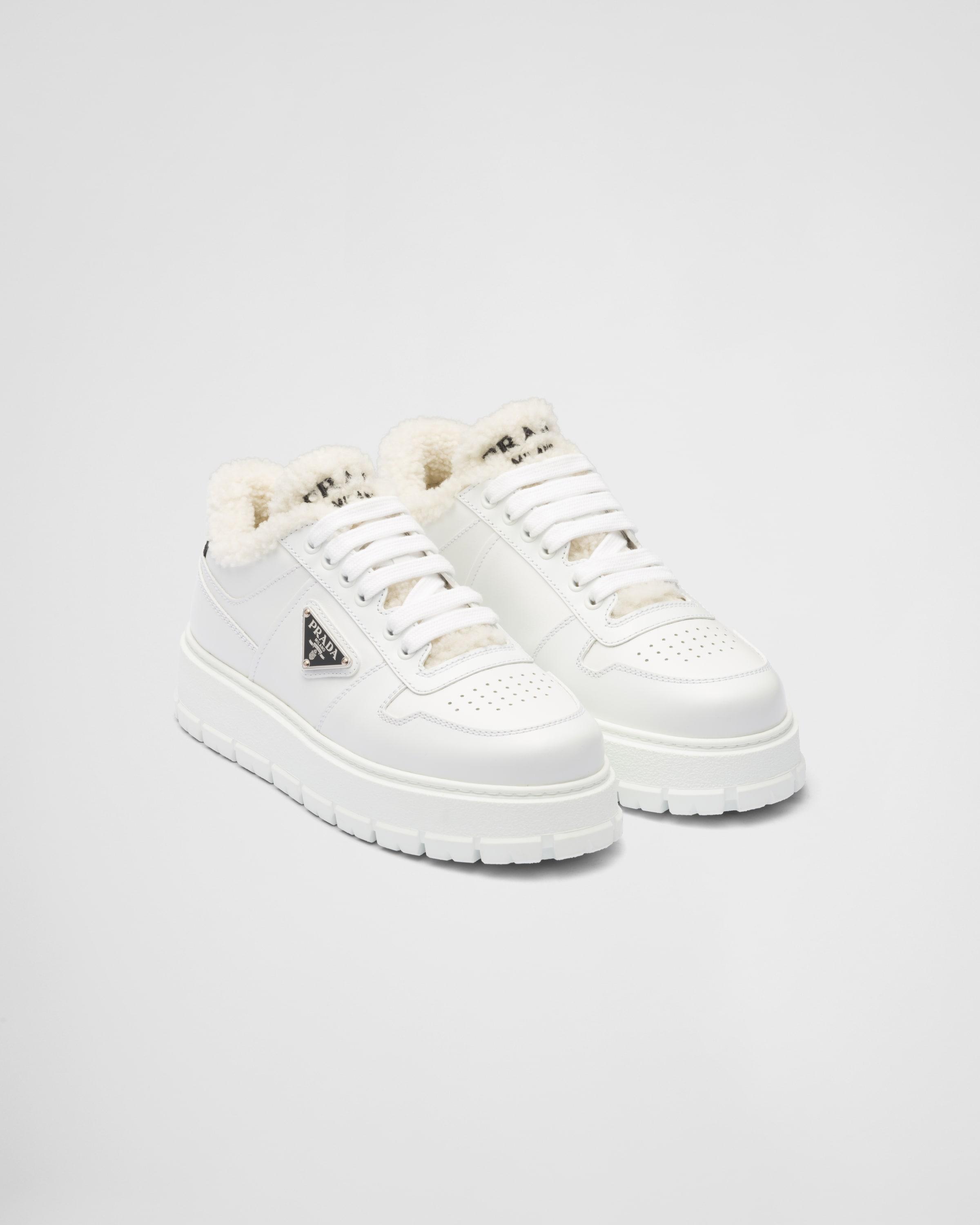 Prada Leather And Shearling Sneakers in White | Lyst