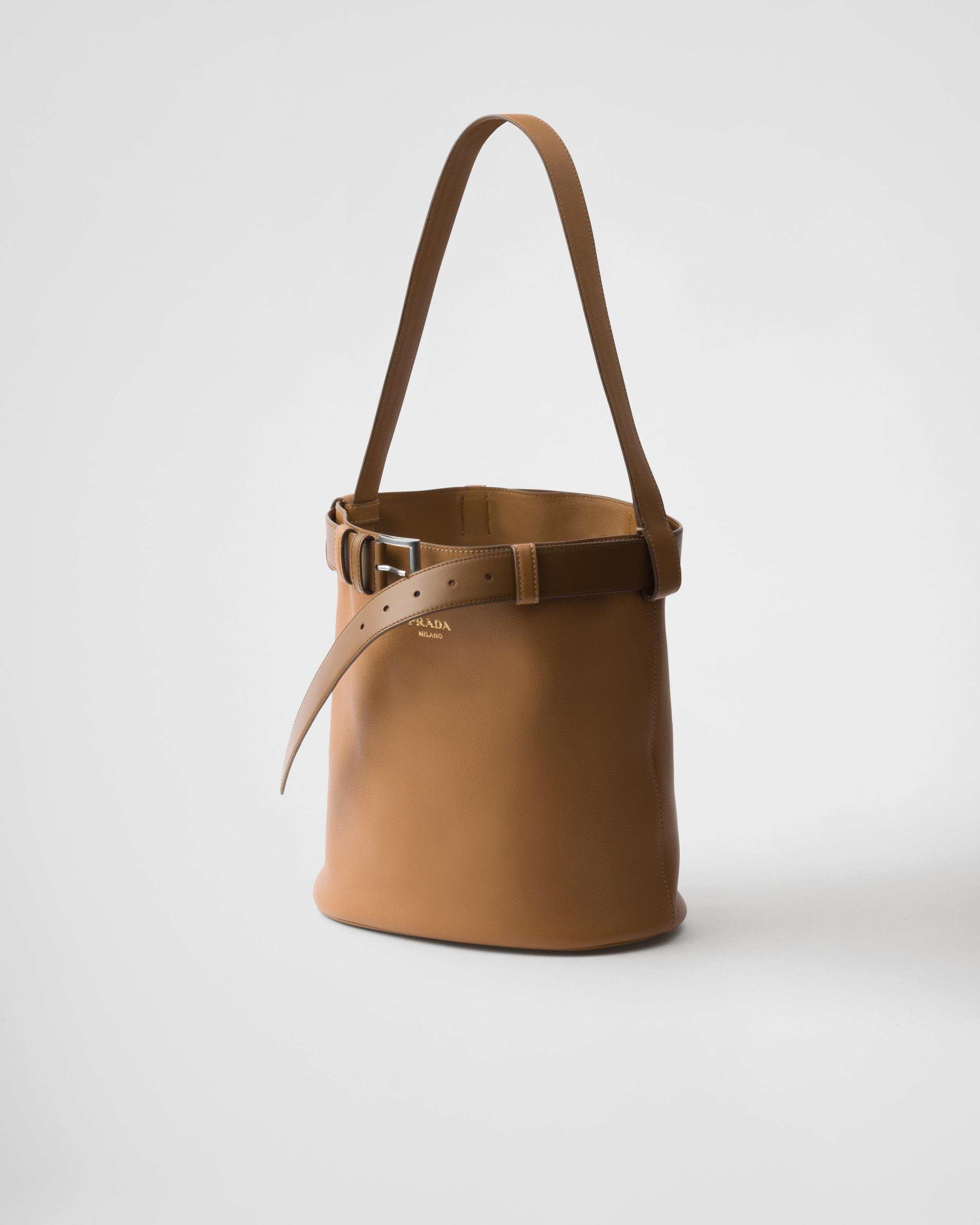 Prada Buckle Leather Bucket Bag With Belt in White | Lyst
