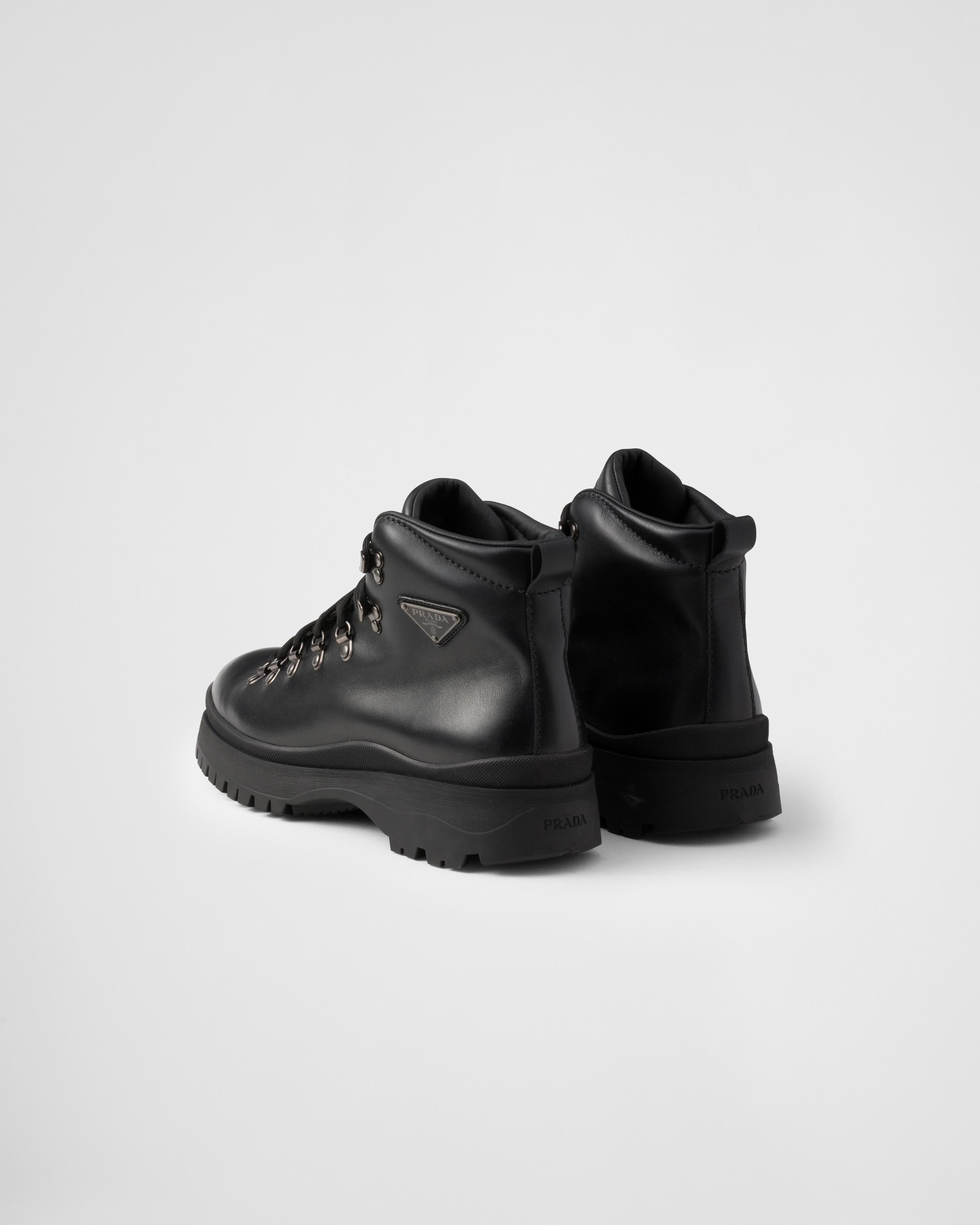 Prada Brixxen Leather Booties in Black for Men Lyst UK