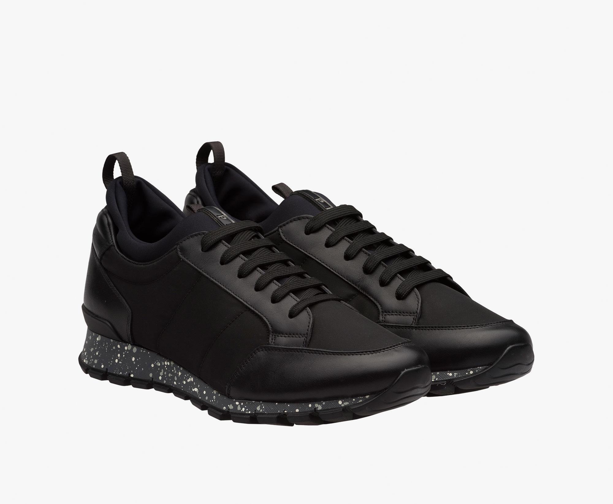 black shiny prada trainers