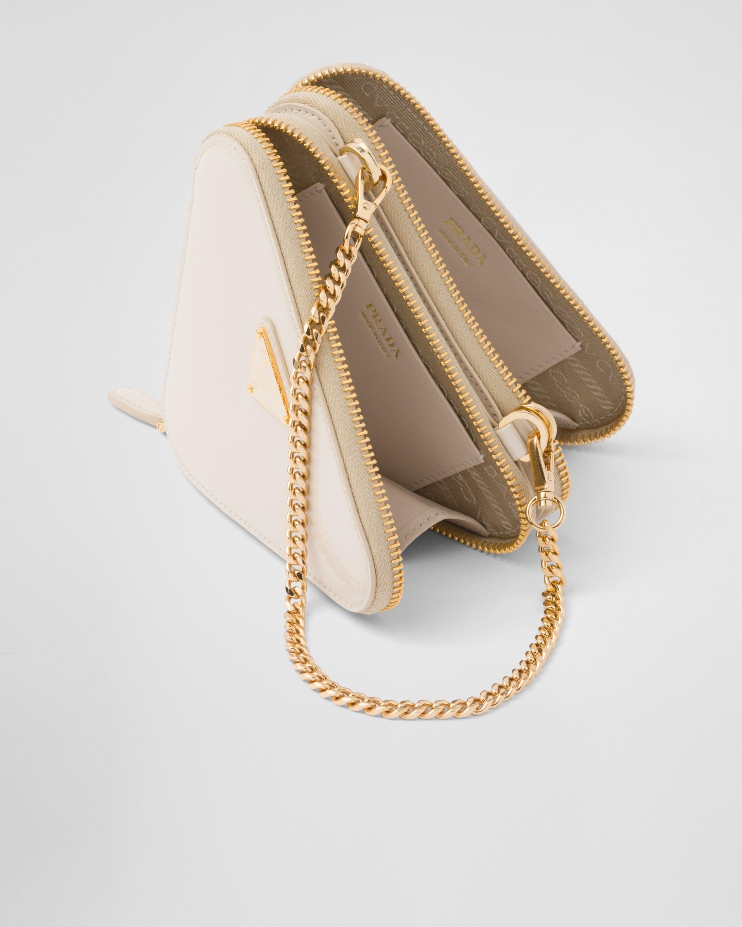 バッグ PRADA Heart mini pouch white Prada Heart Lock Mini Cross Body Bag in White | Hypebae