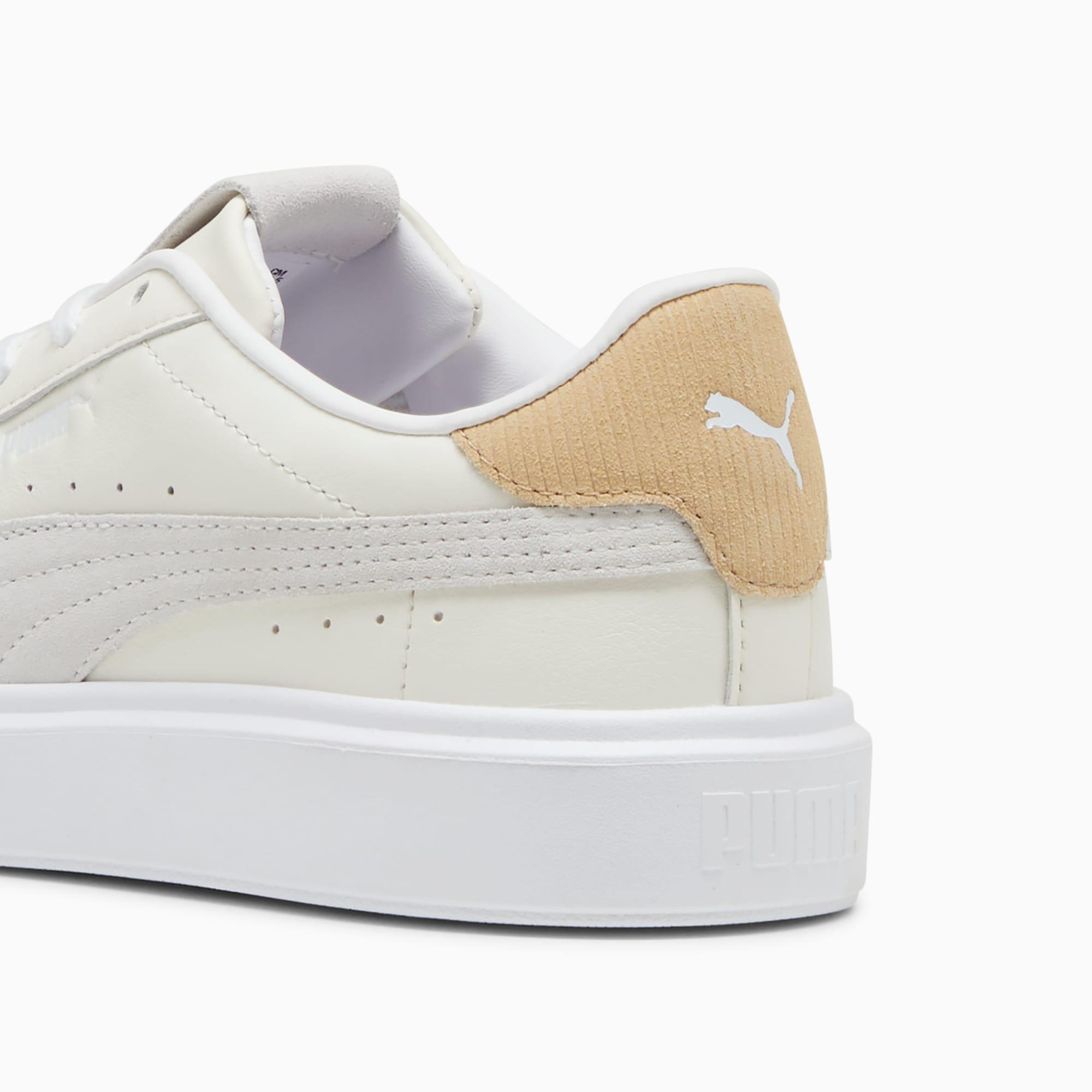 white pumas with gold toe