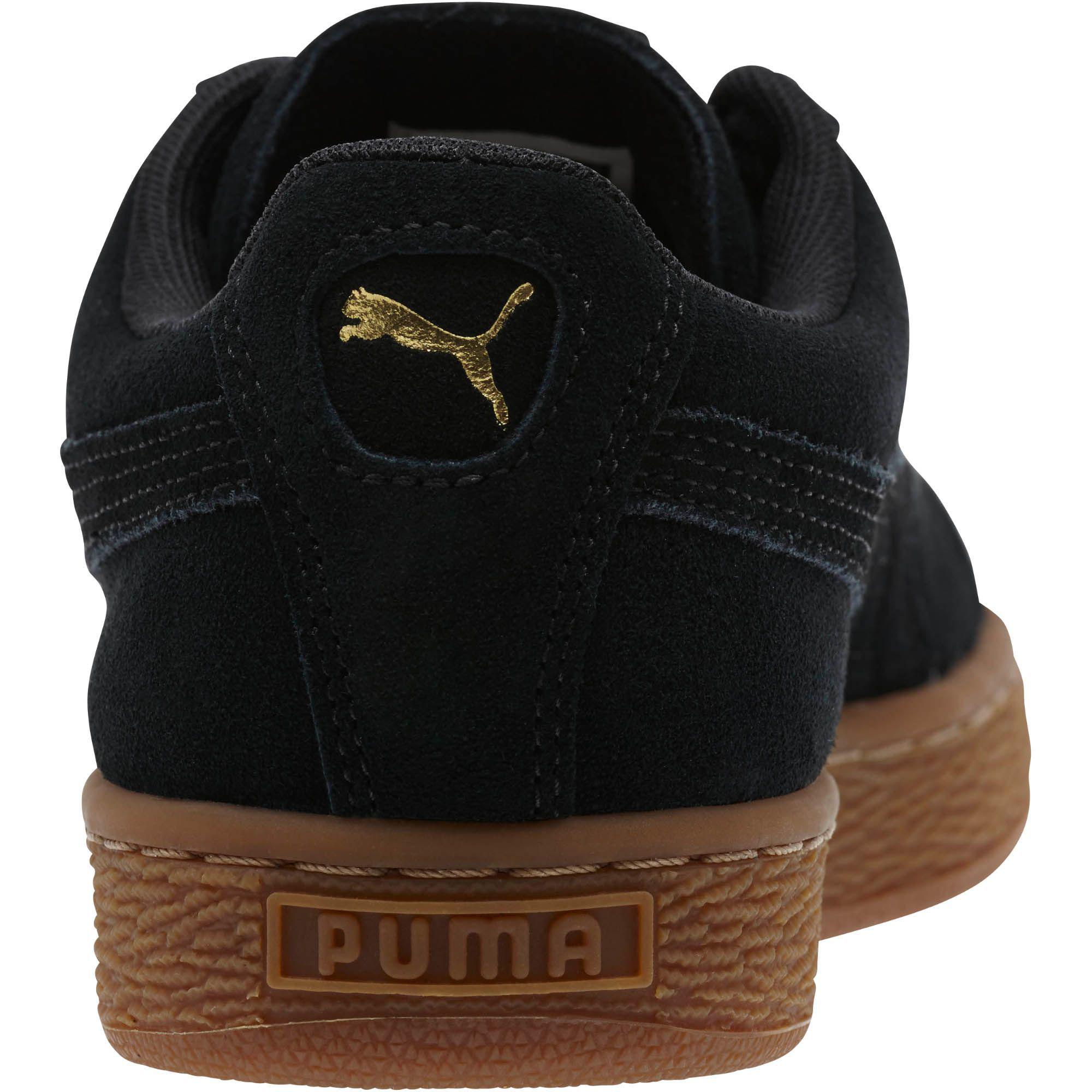 black puma shoes with gold
