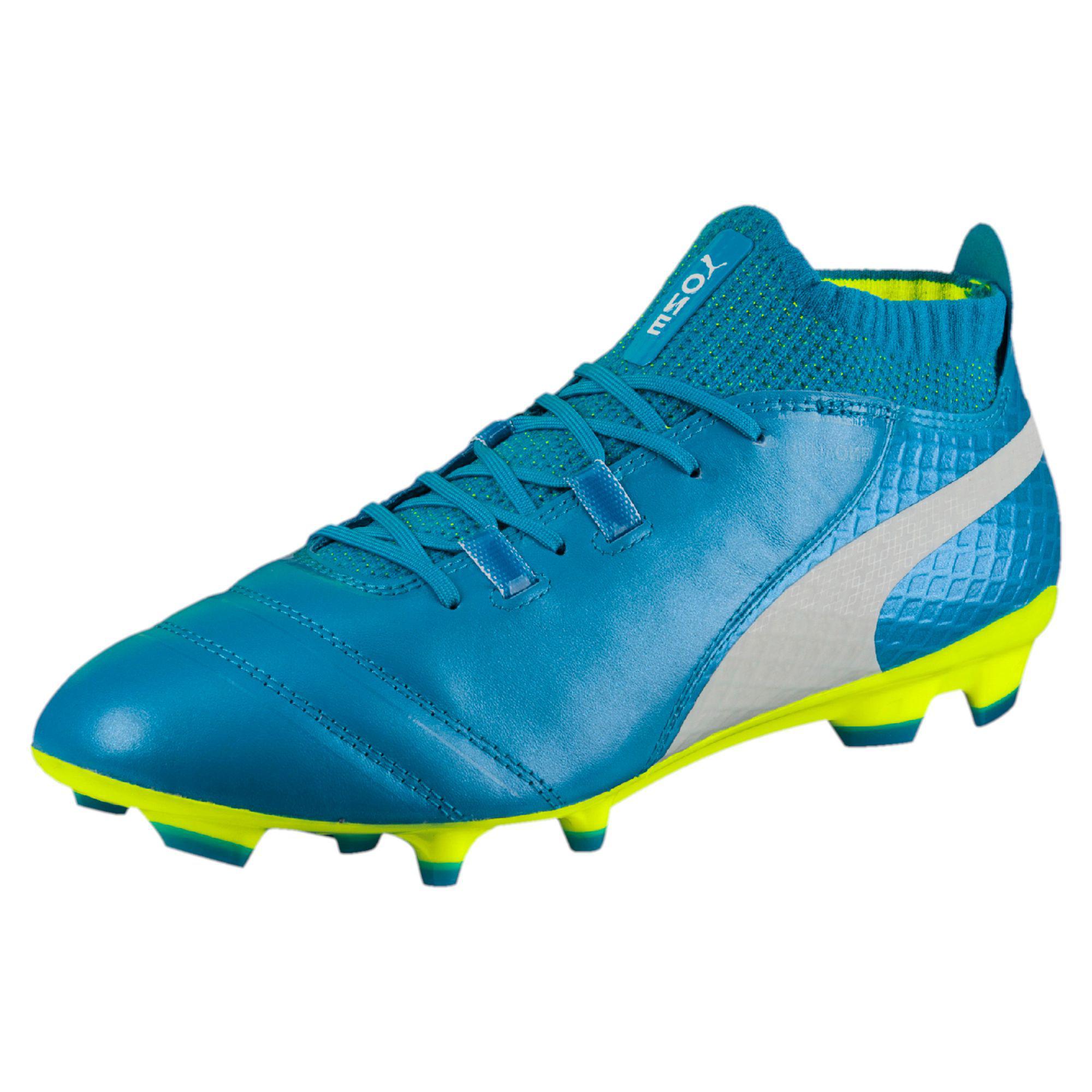 blue and yellow soccer cleats