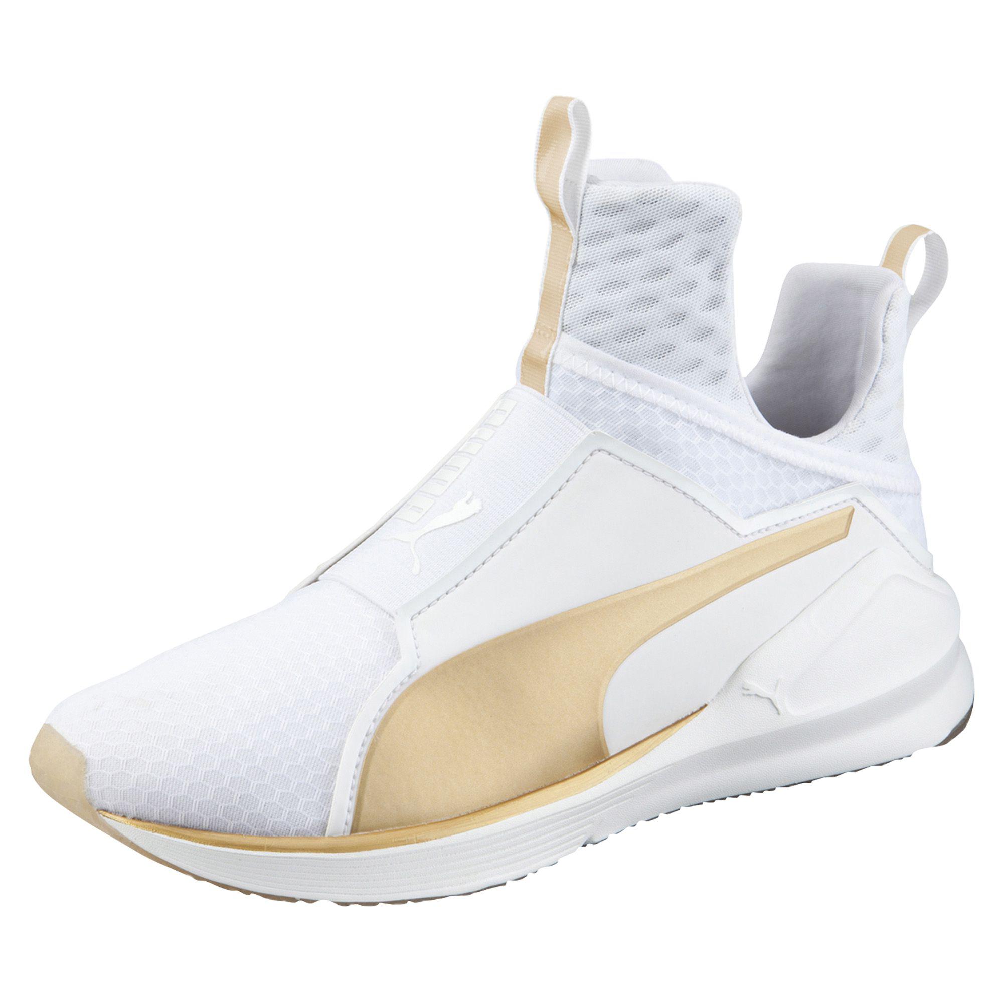 white and gold pumas with strap