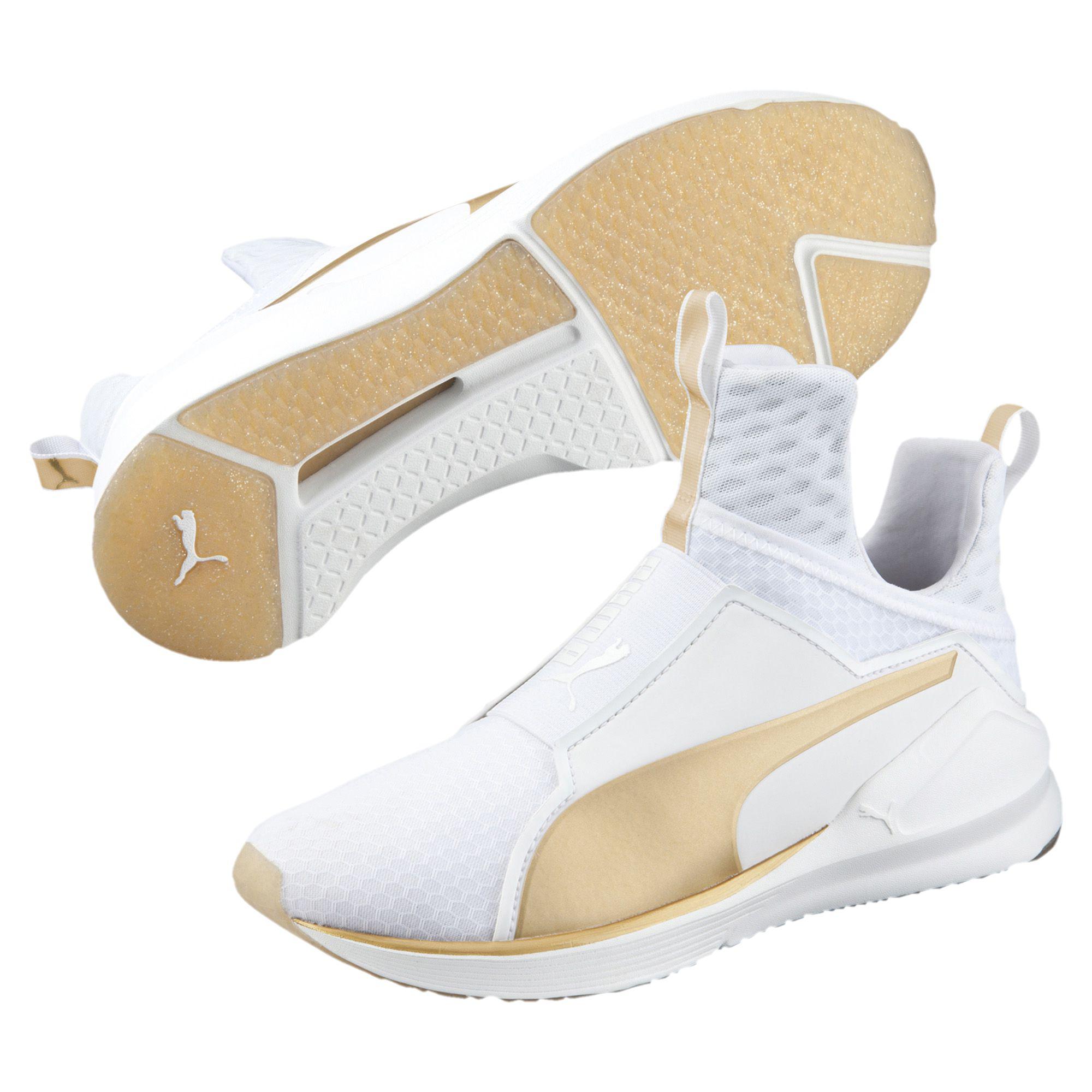 white and gold puma trainers