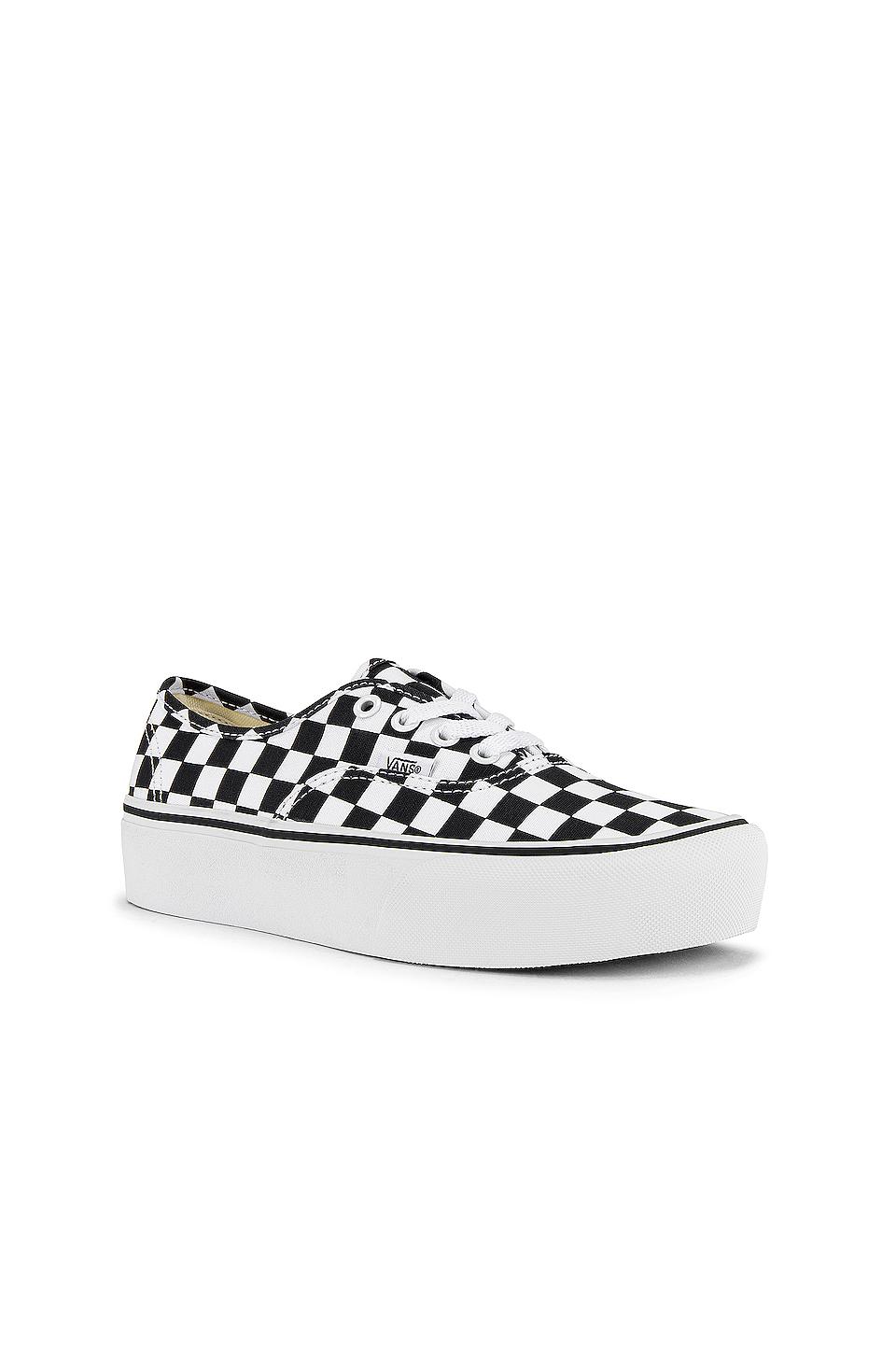tan and white checkerboard vans