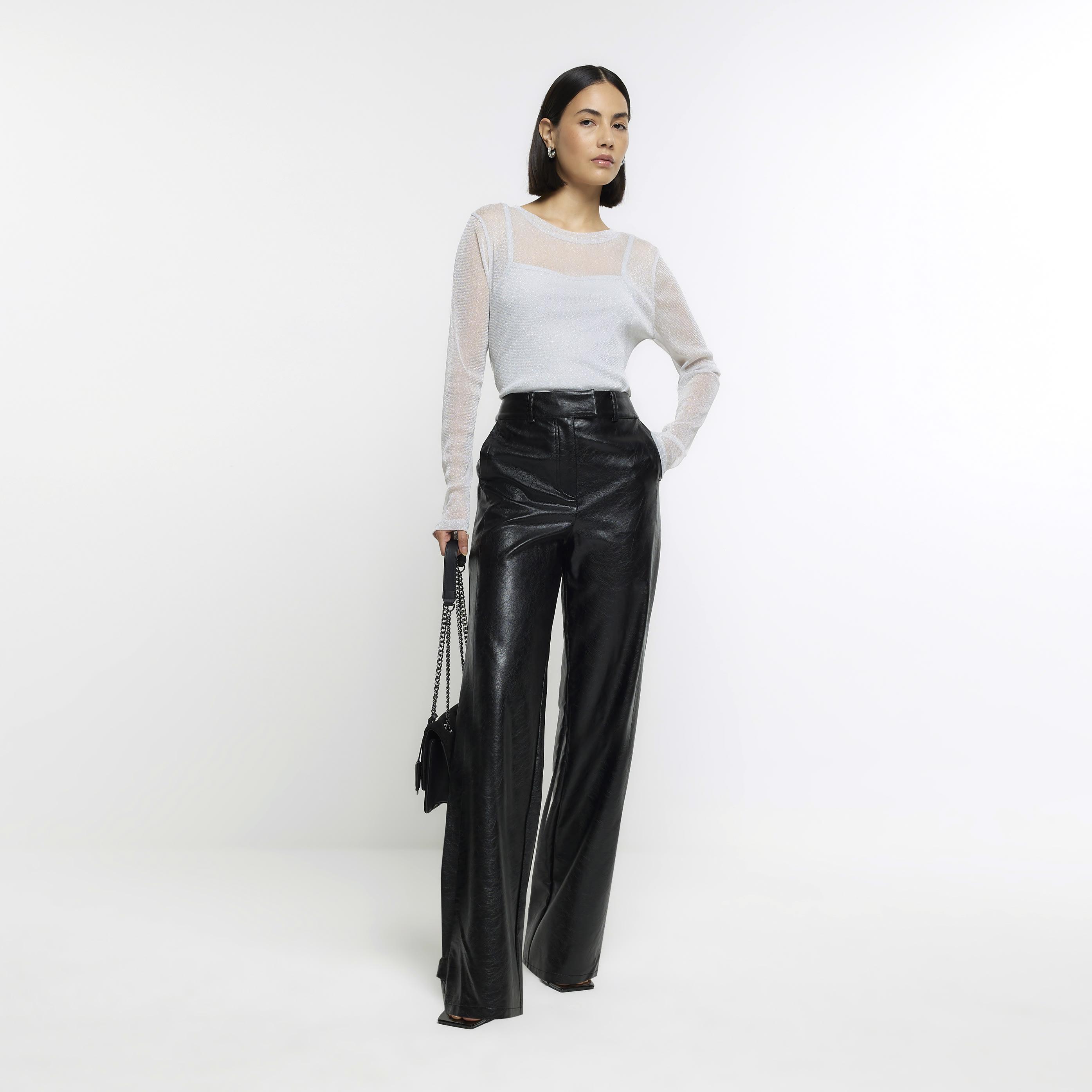 Petite black faux leather skinny trousers | River Island