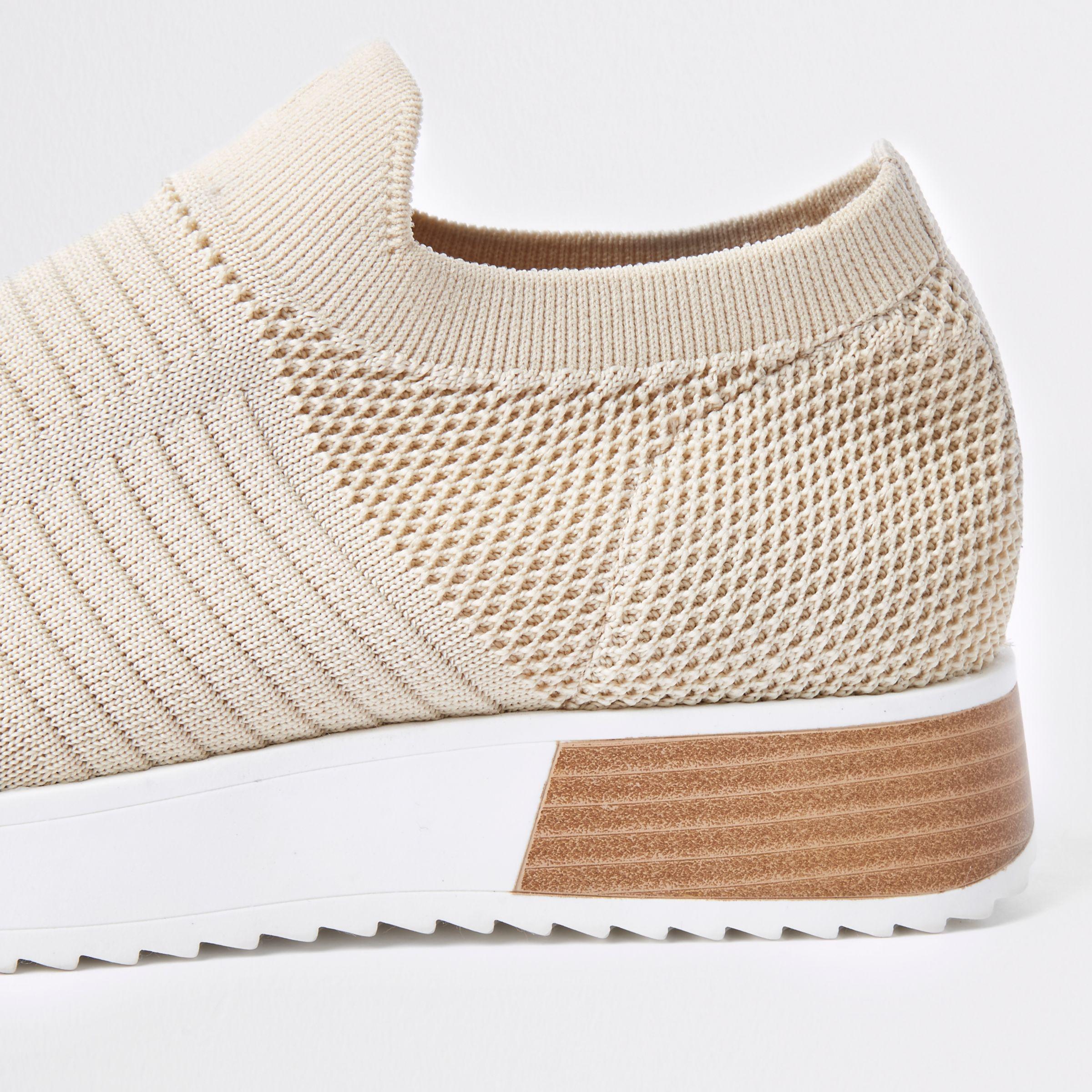 beige knitted trainers