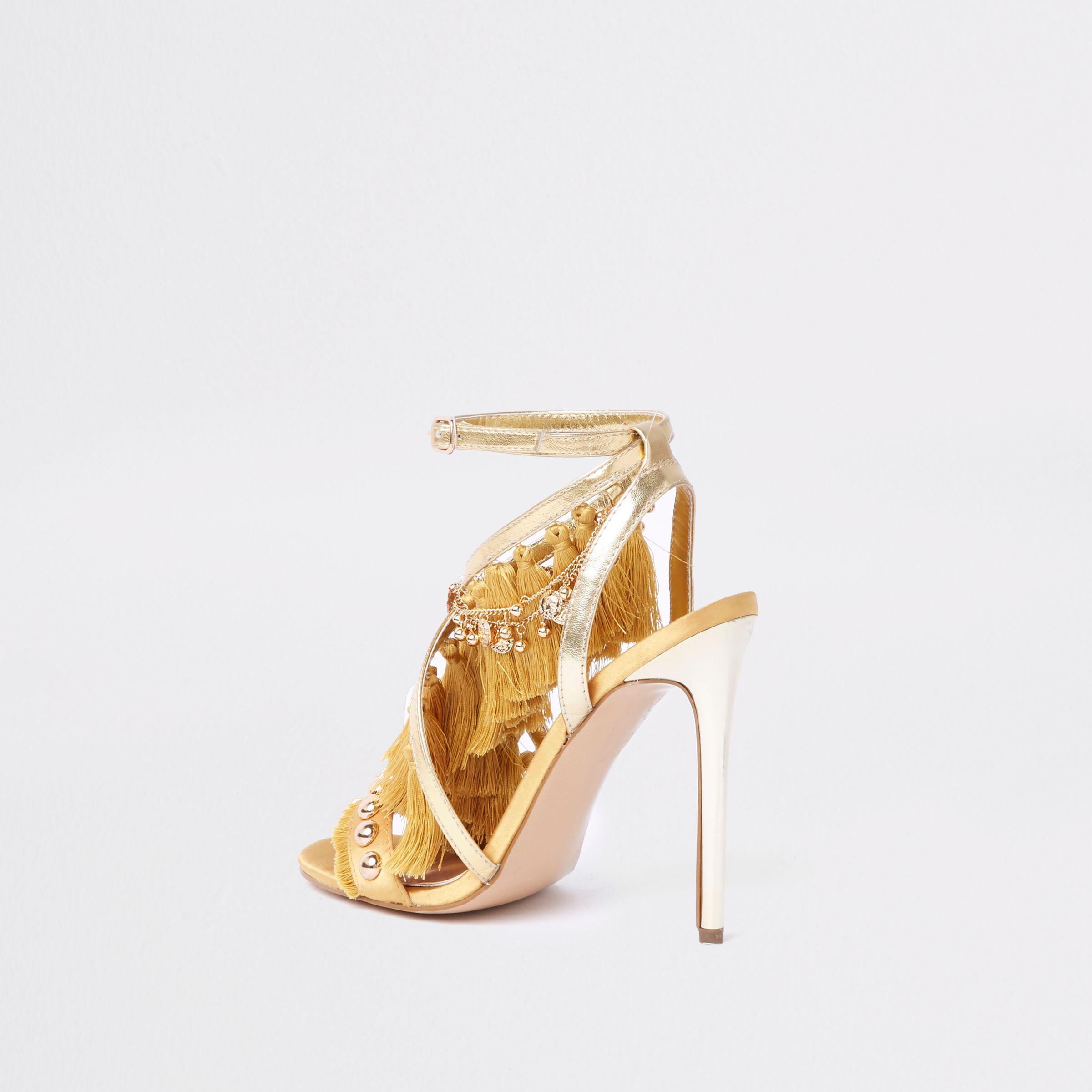 gold tassel heels