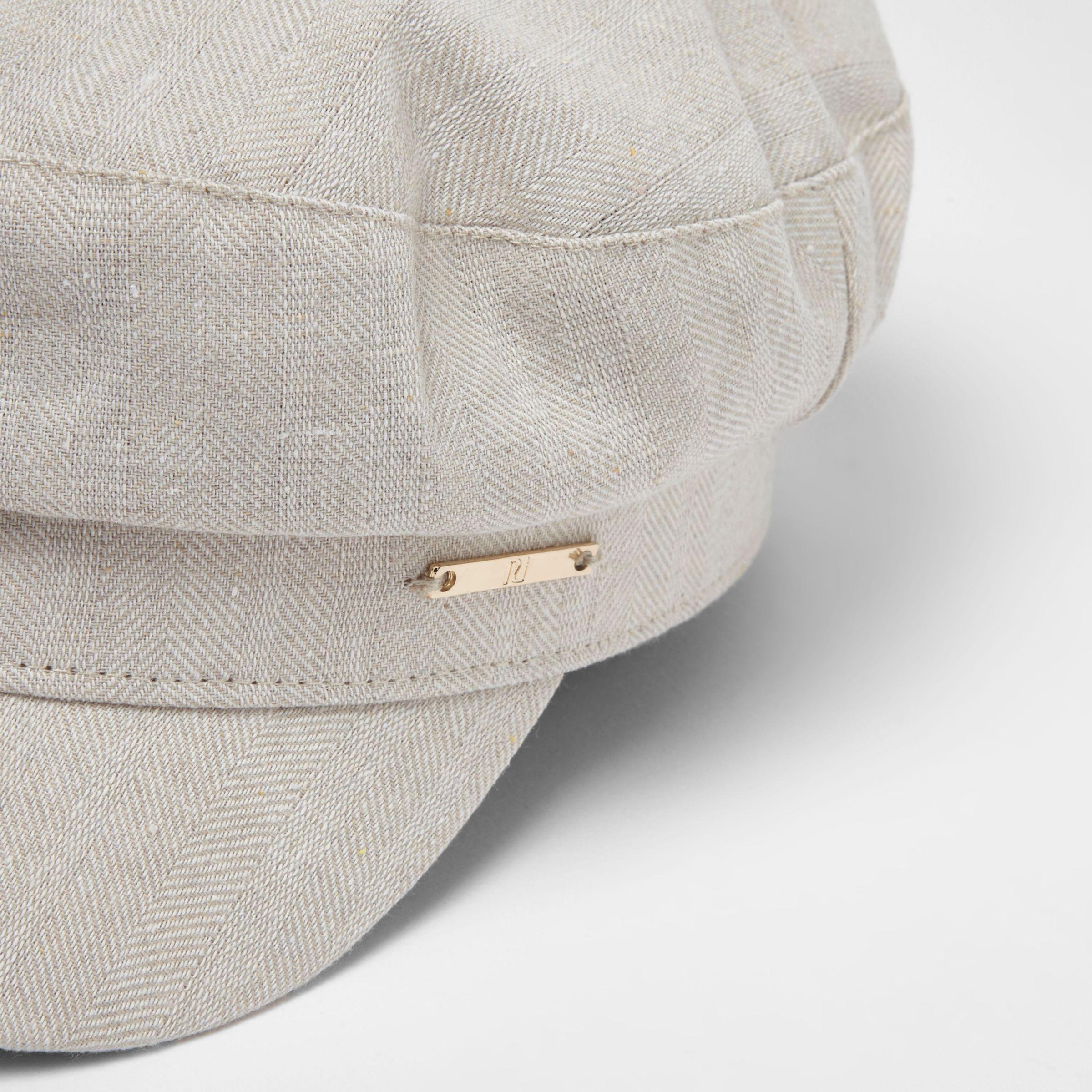 cream baker boy hat