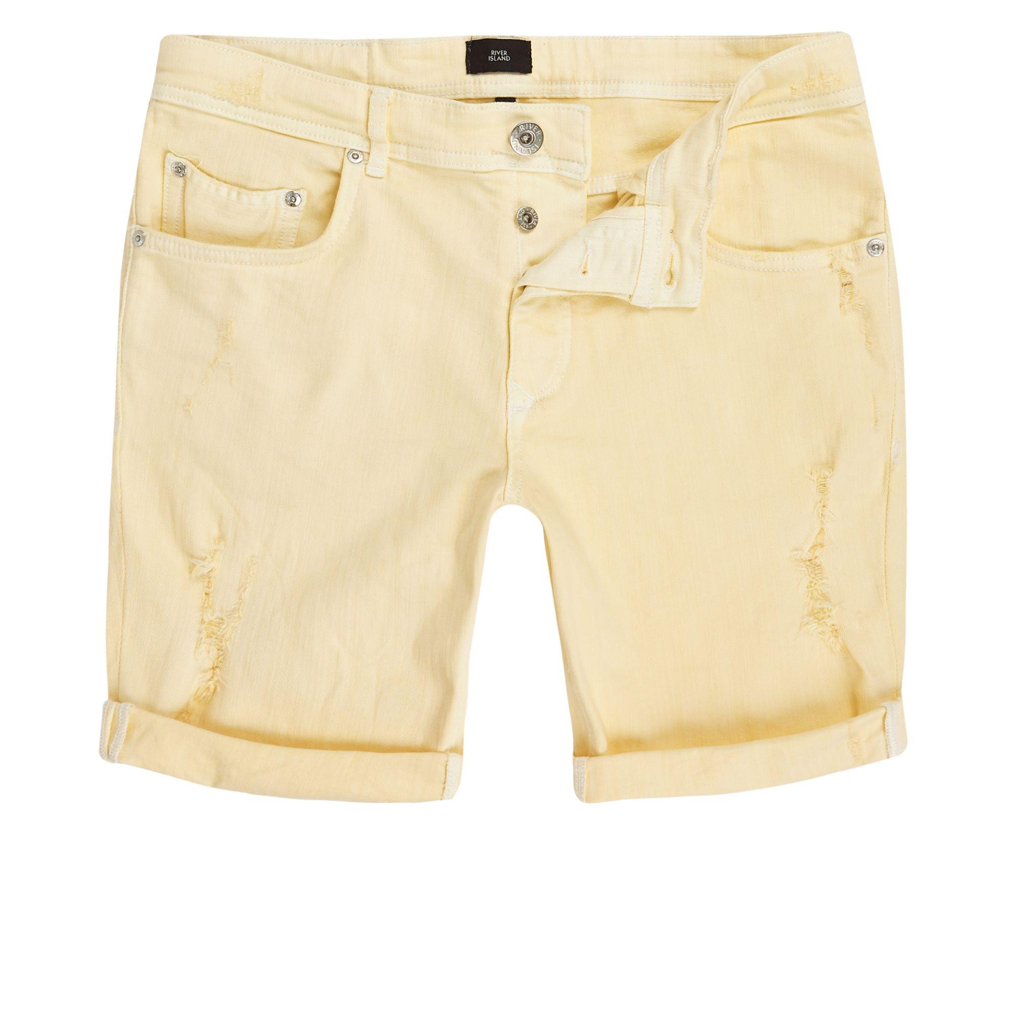 yellow ripped shorts