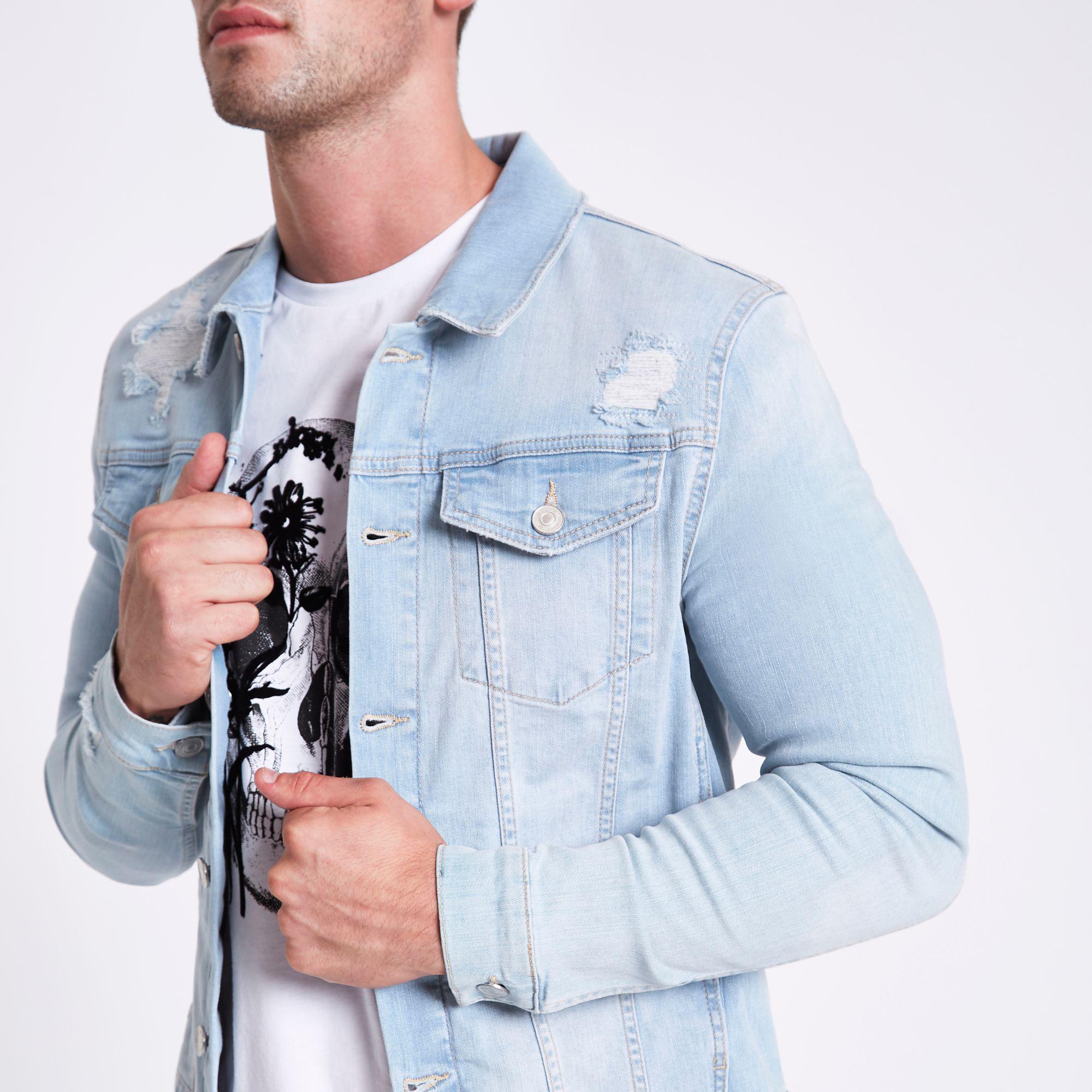 light blue ripped jean jacket