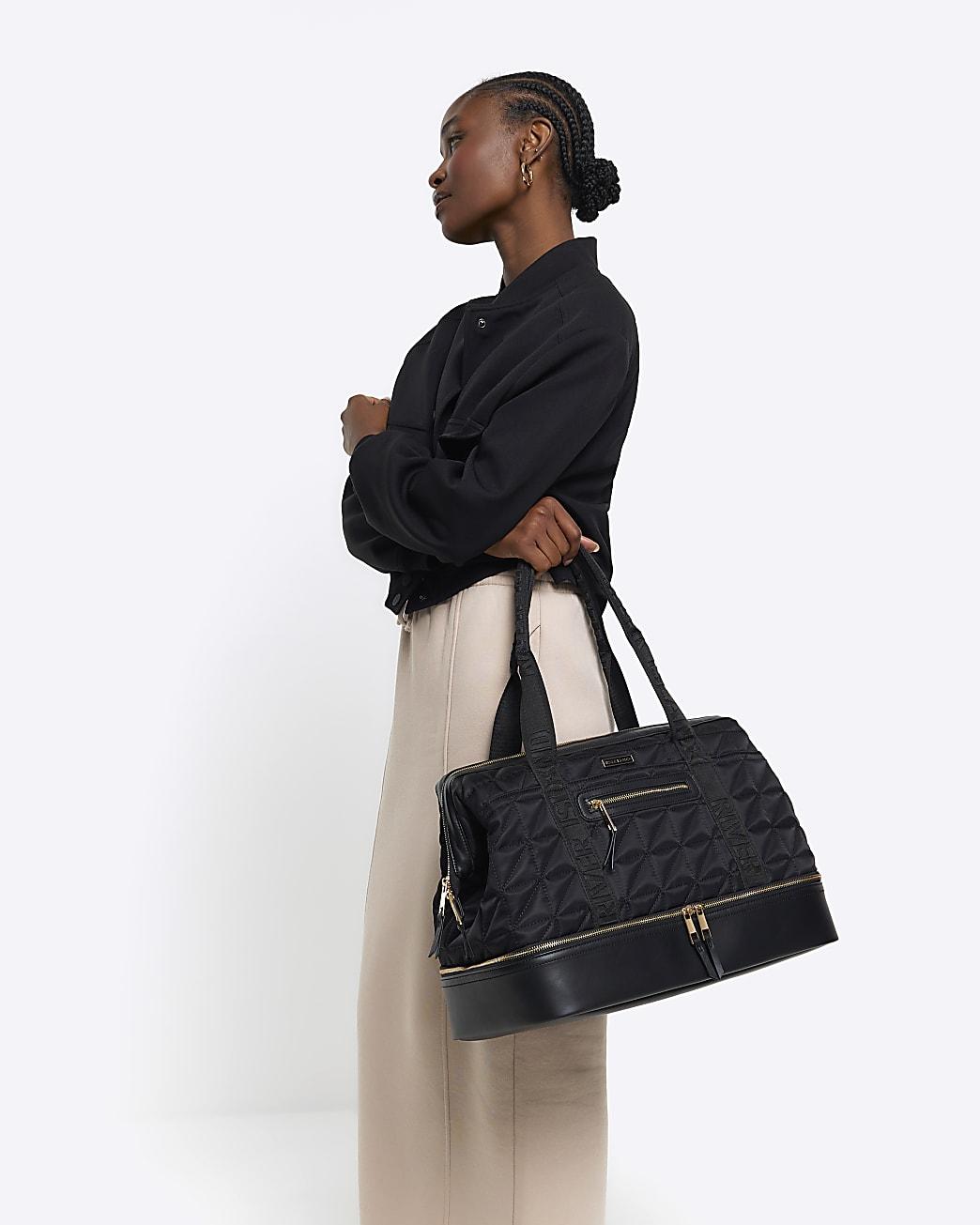 Black quilted travel bag top