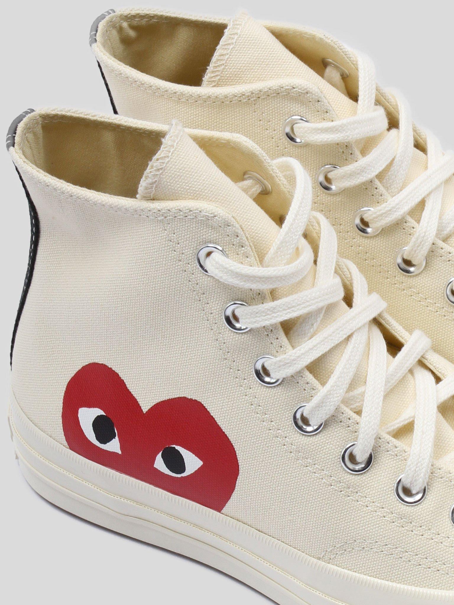 high top white converse with red heart