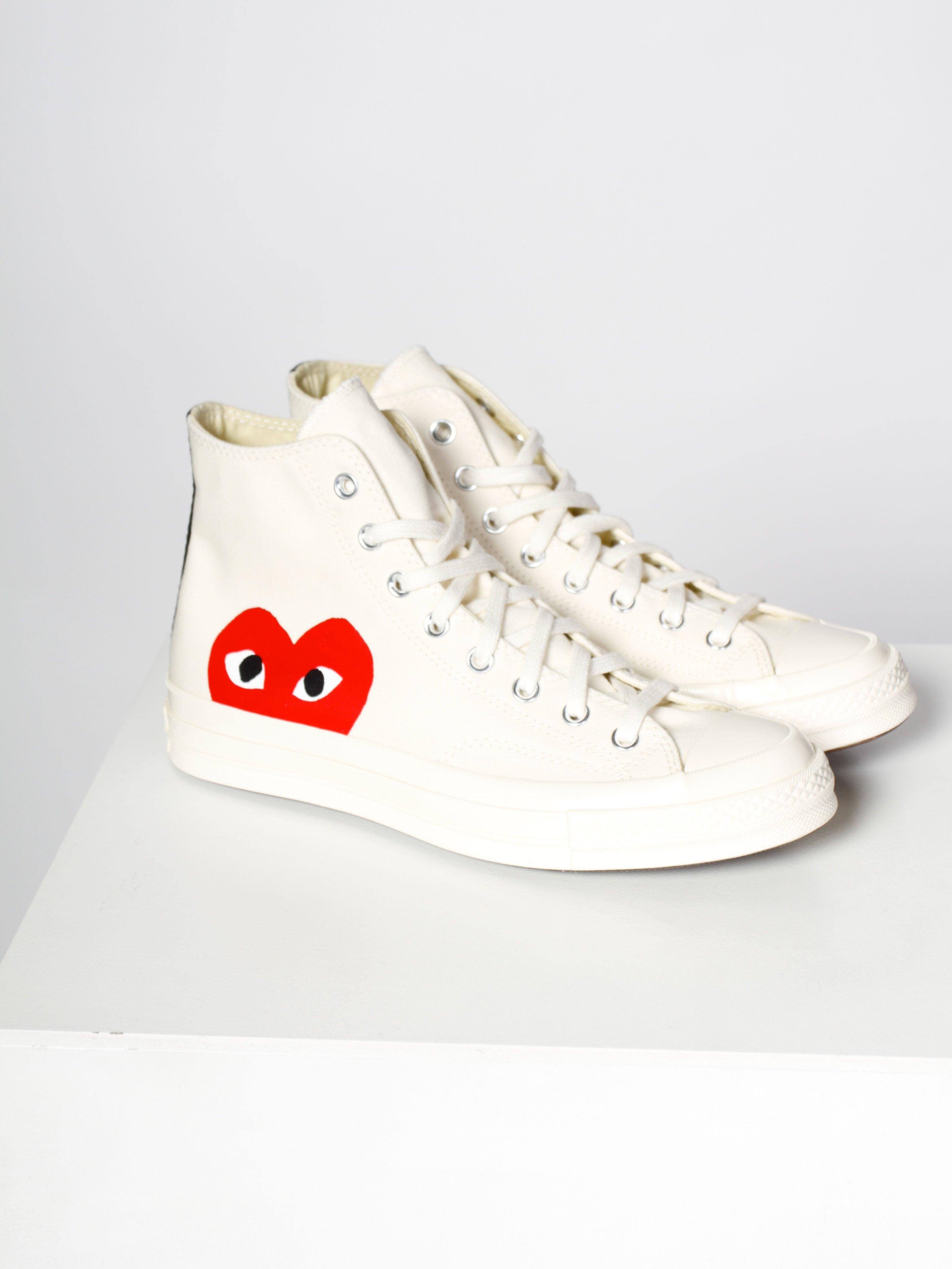 white converse with red heart