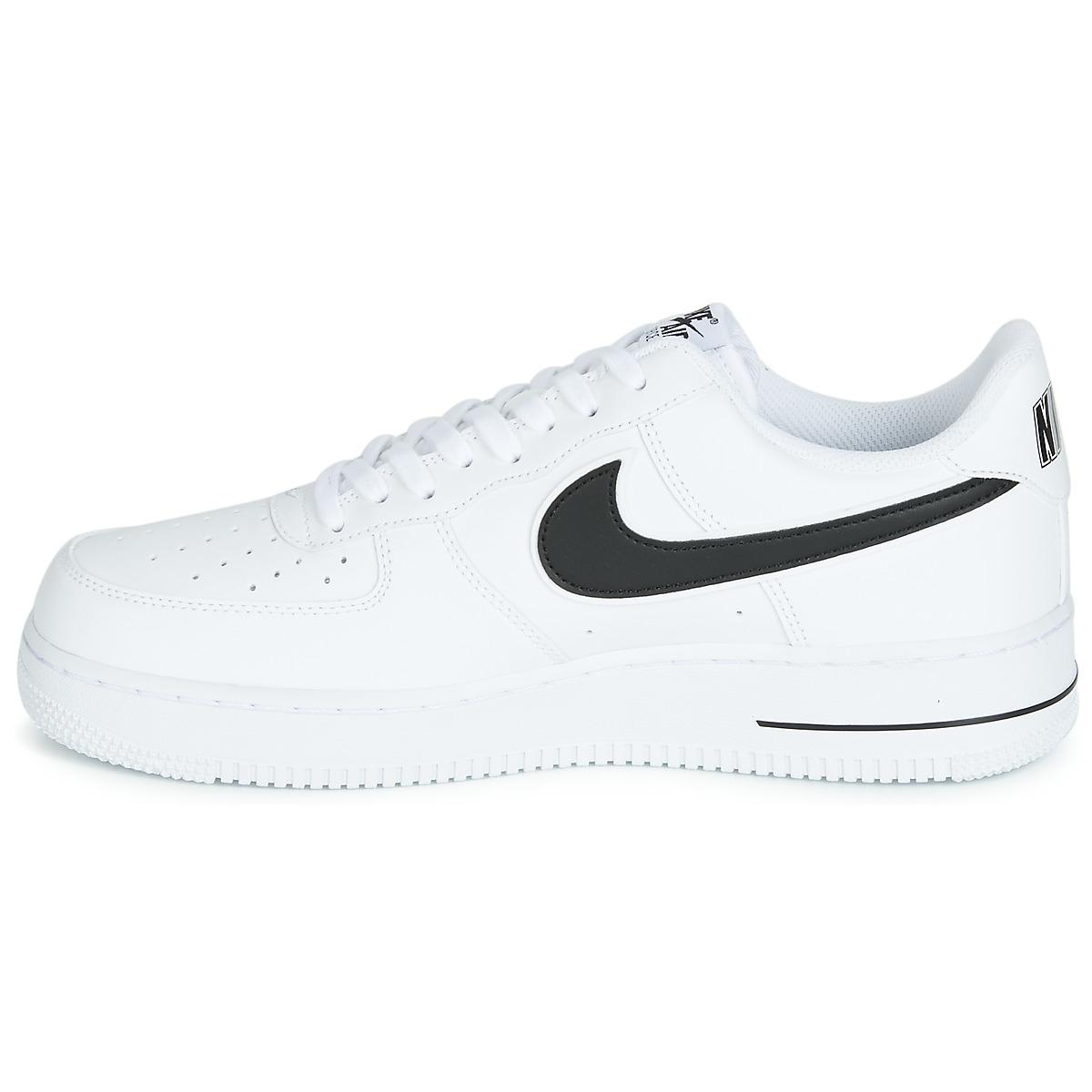 nike white trainers with black tick