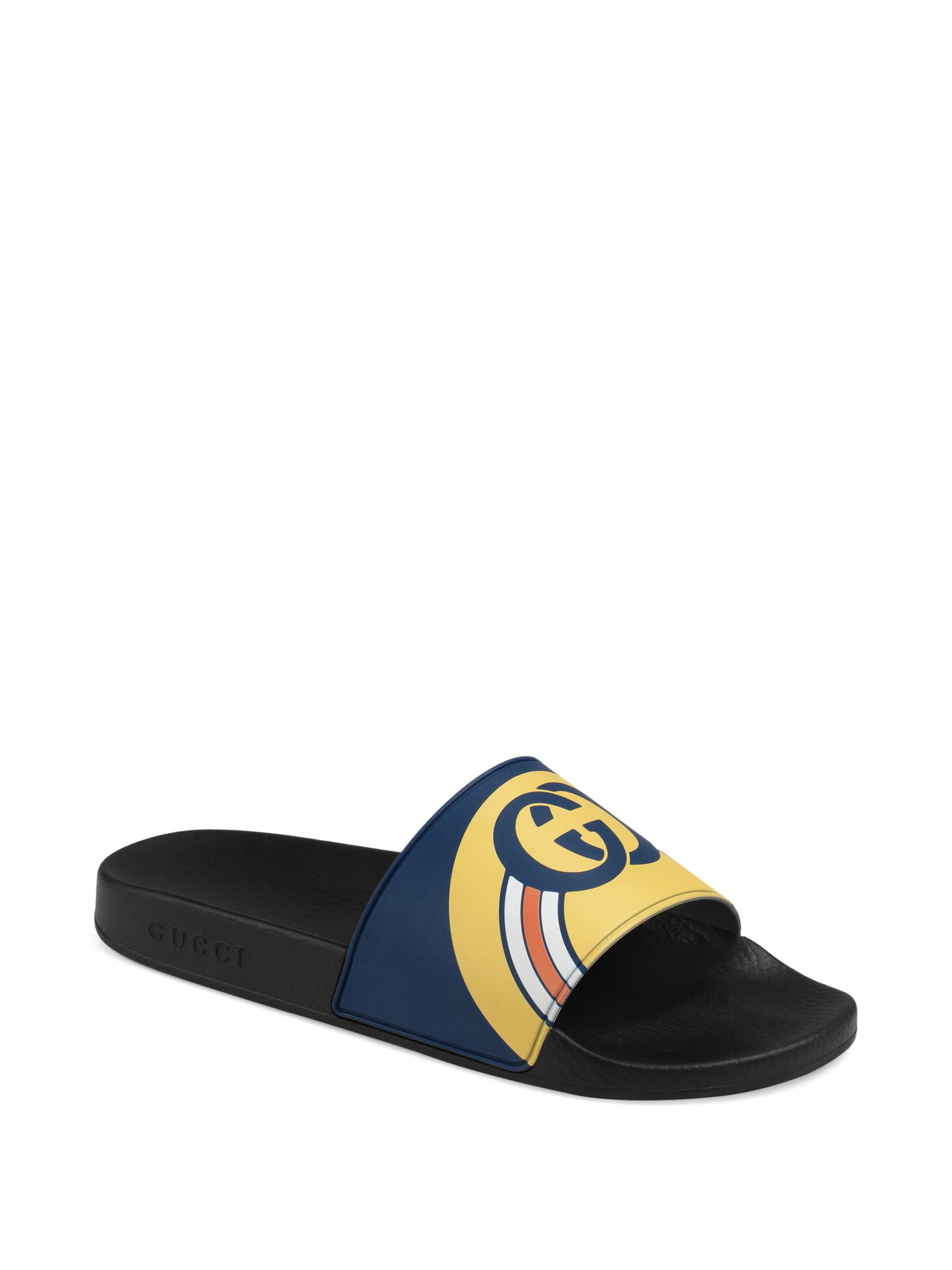 blue and yellow gucci slides