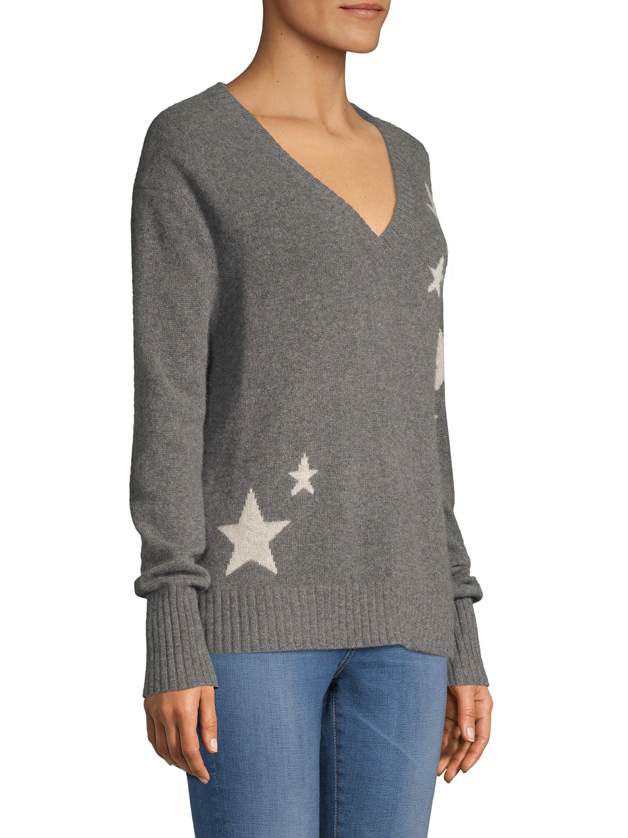 gray sweater with stars