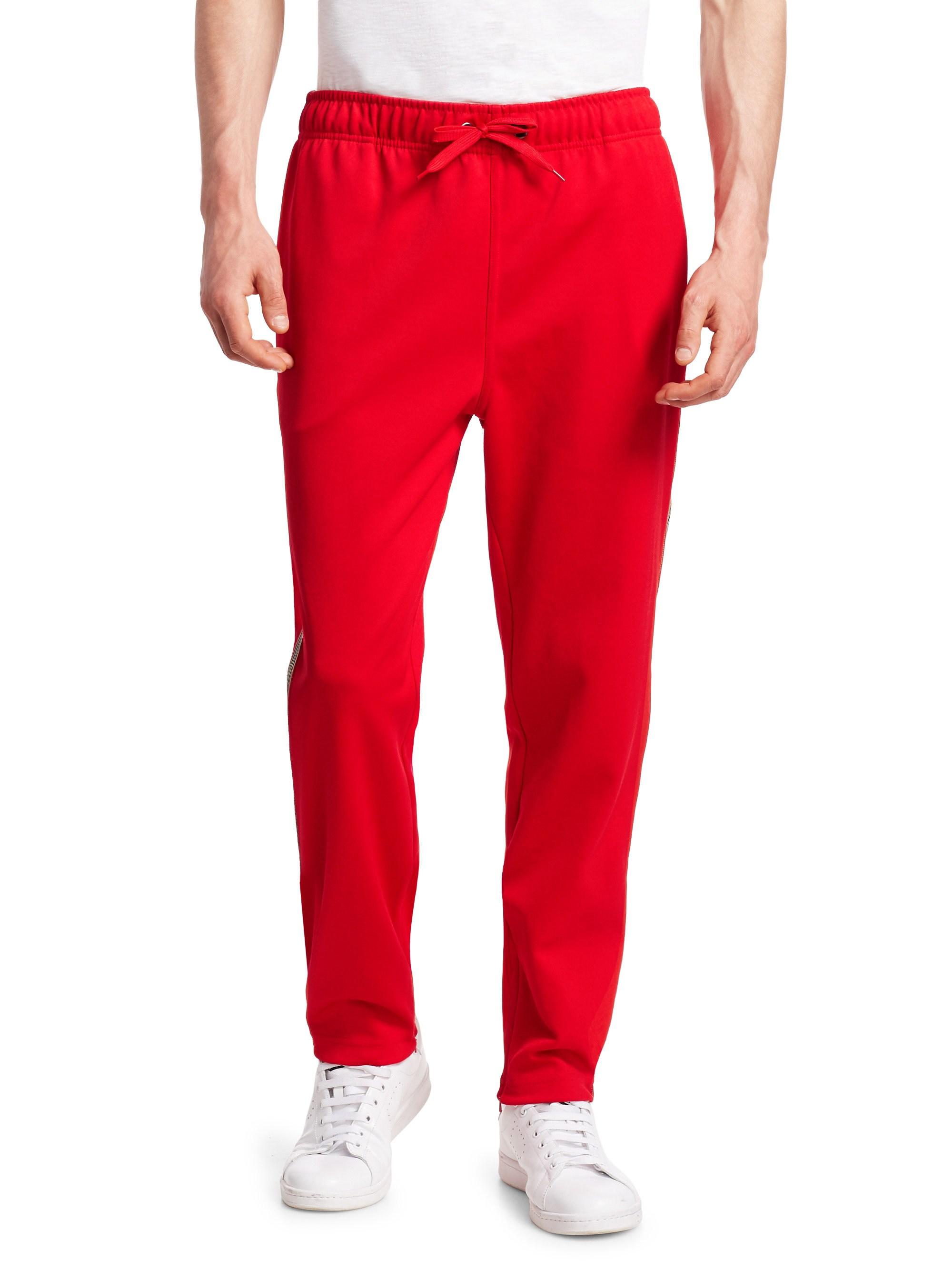 men's green track pants with red stripe