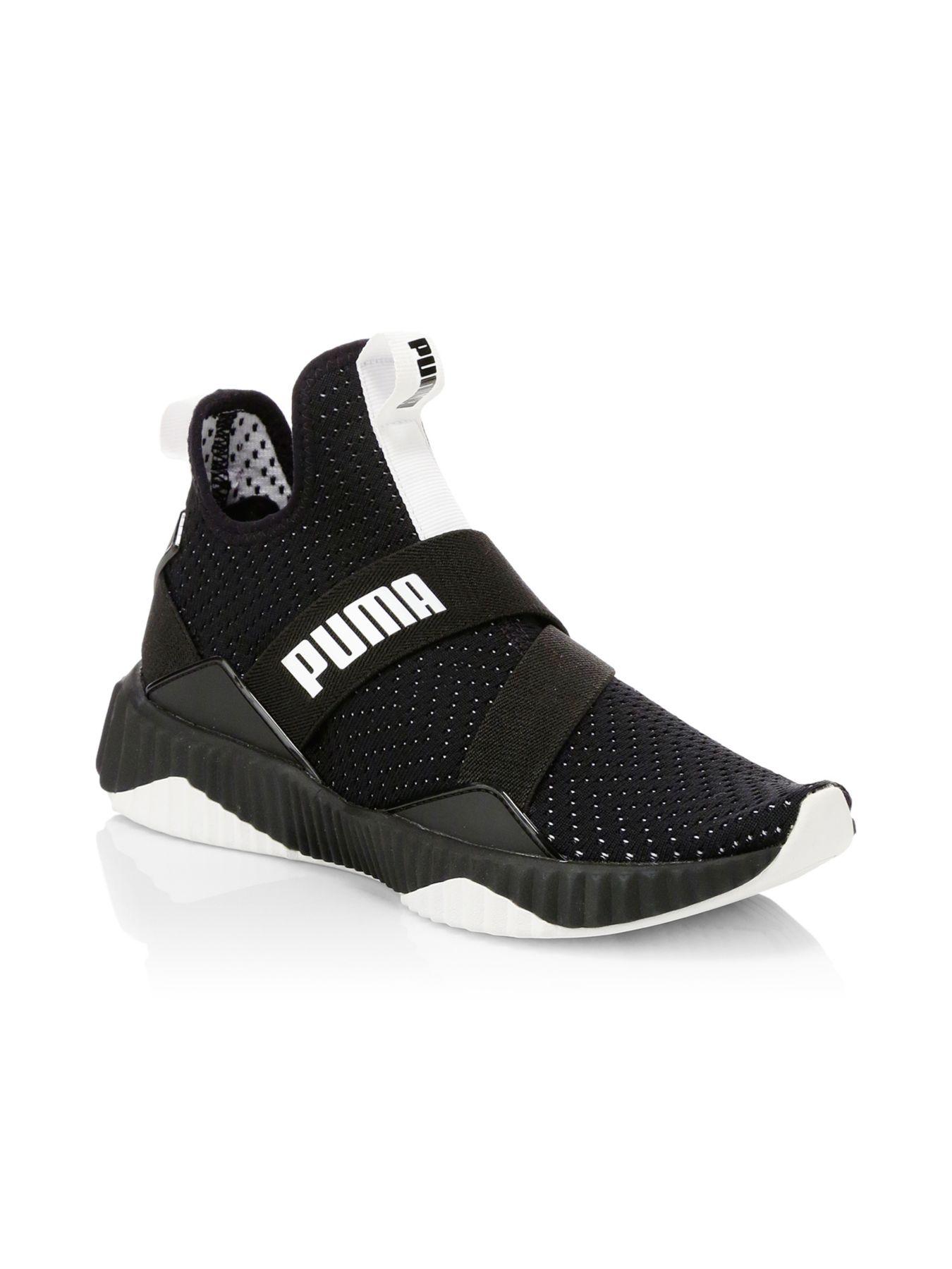 PUMA Defy Mid Core Shoes in Black | Lyst