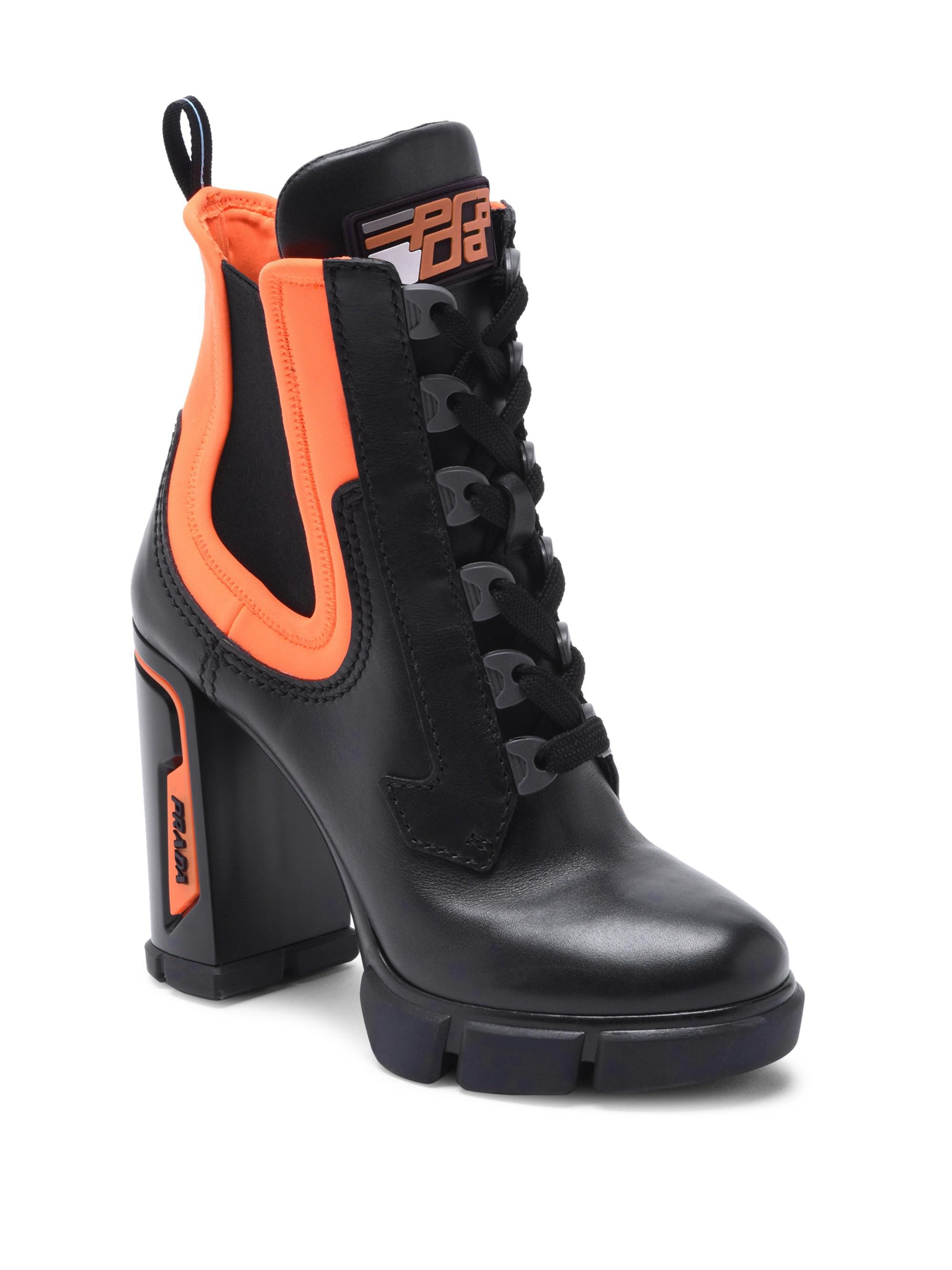 black and orange prada boots