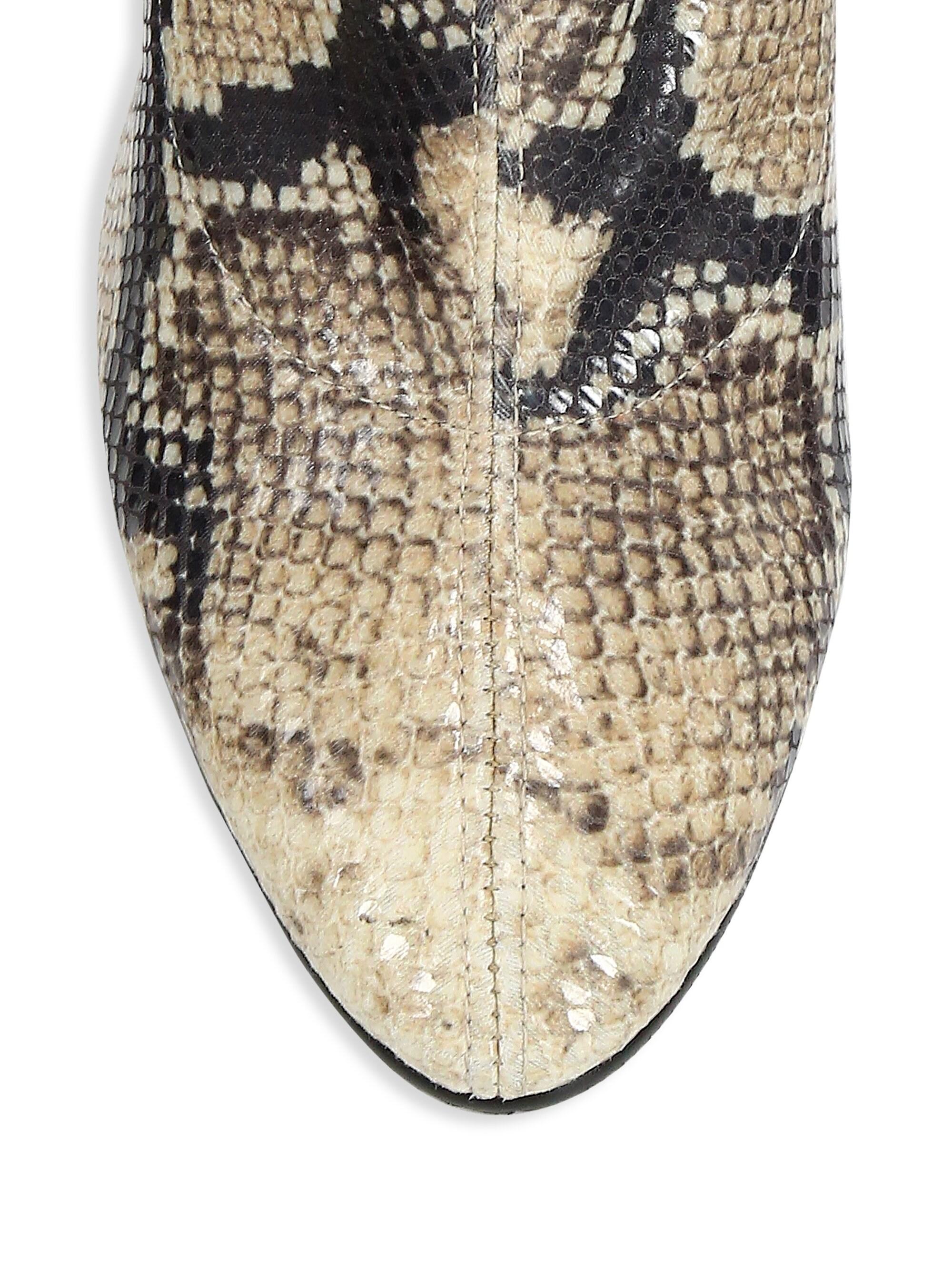 snakeskin print over the knee boots