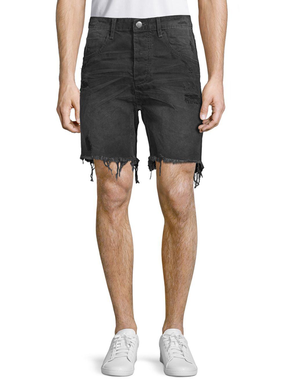 frayed black denim shorts