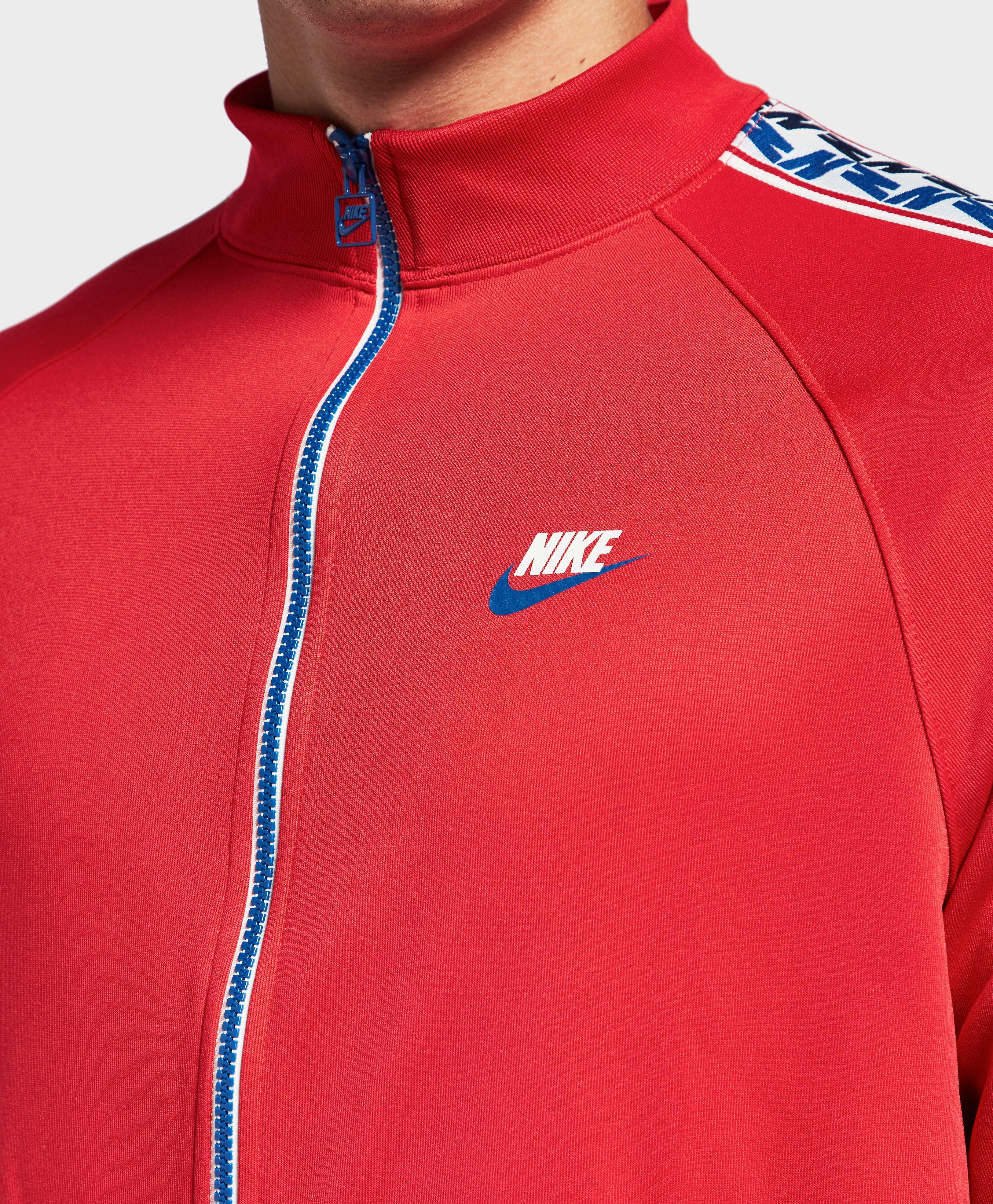 nike arch taped track top